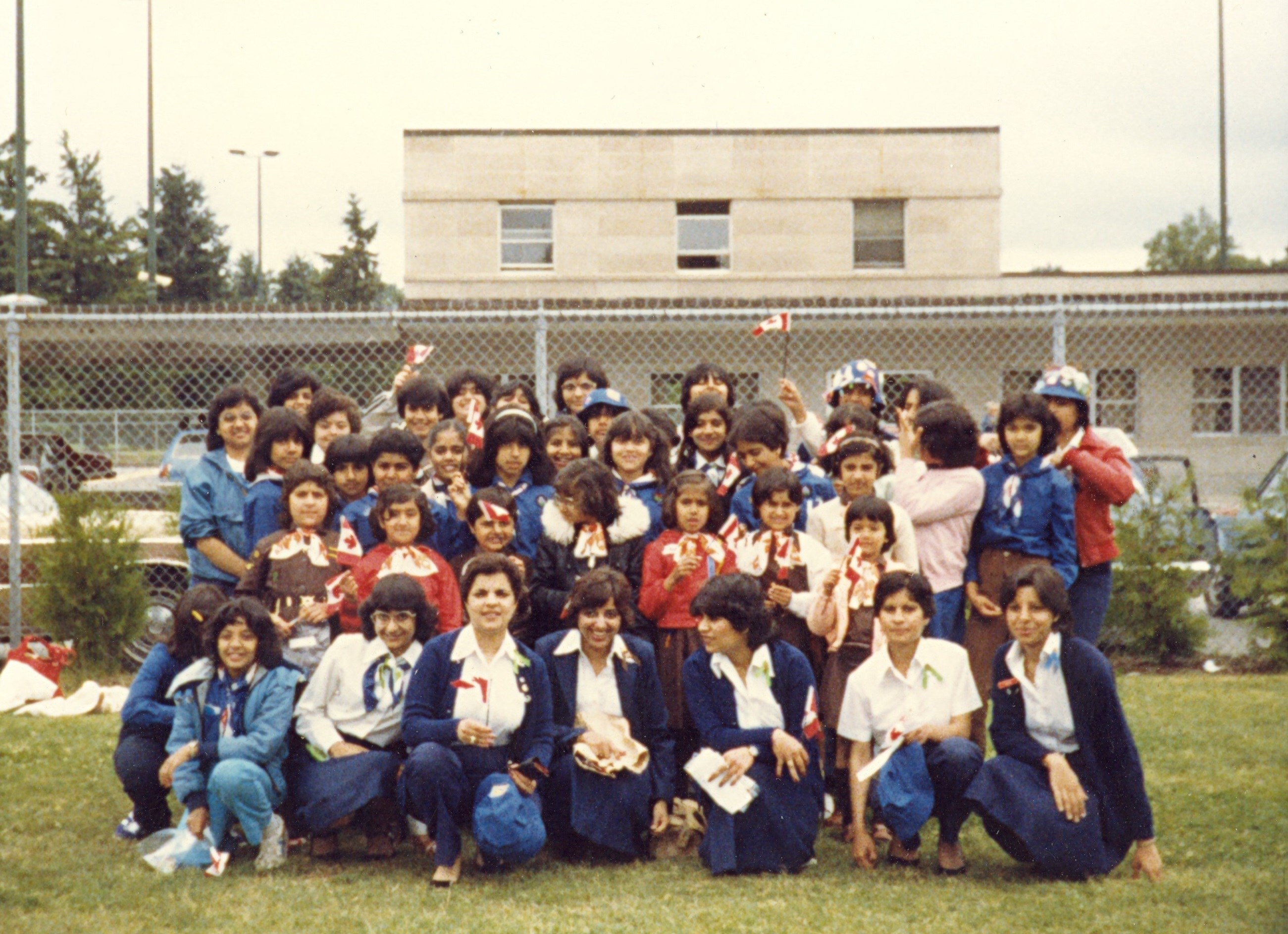 Senator Mobina Jaffer crowds in with a gaggle of guides in British Columbia in the 1980s. (Photo credit: Office of Senator Jaffer)