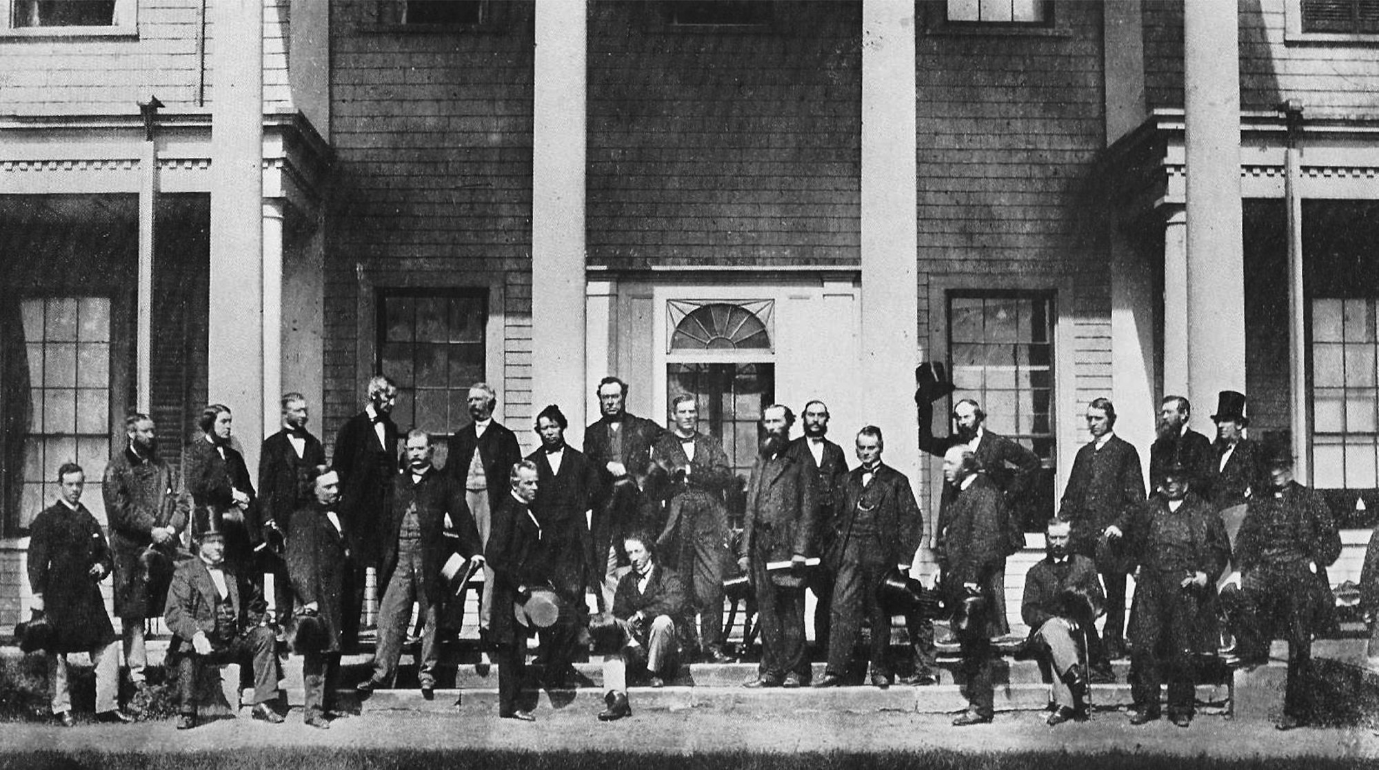 The Fathers of Confederation: Delegates at the 1864 Charlottetown Conference pose for a group portrait in front of Government House, where they attended a banquet and ball hosted by Lieutenant Governor George Dundas. (Photo credit: Library and Archives Canada)