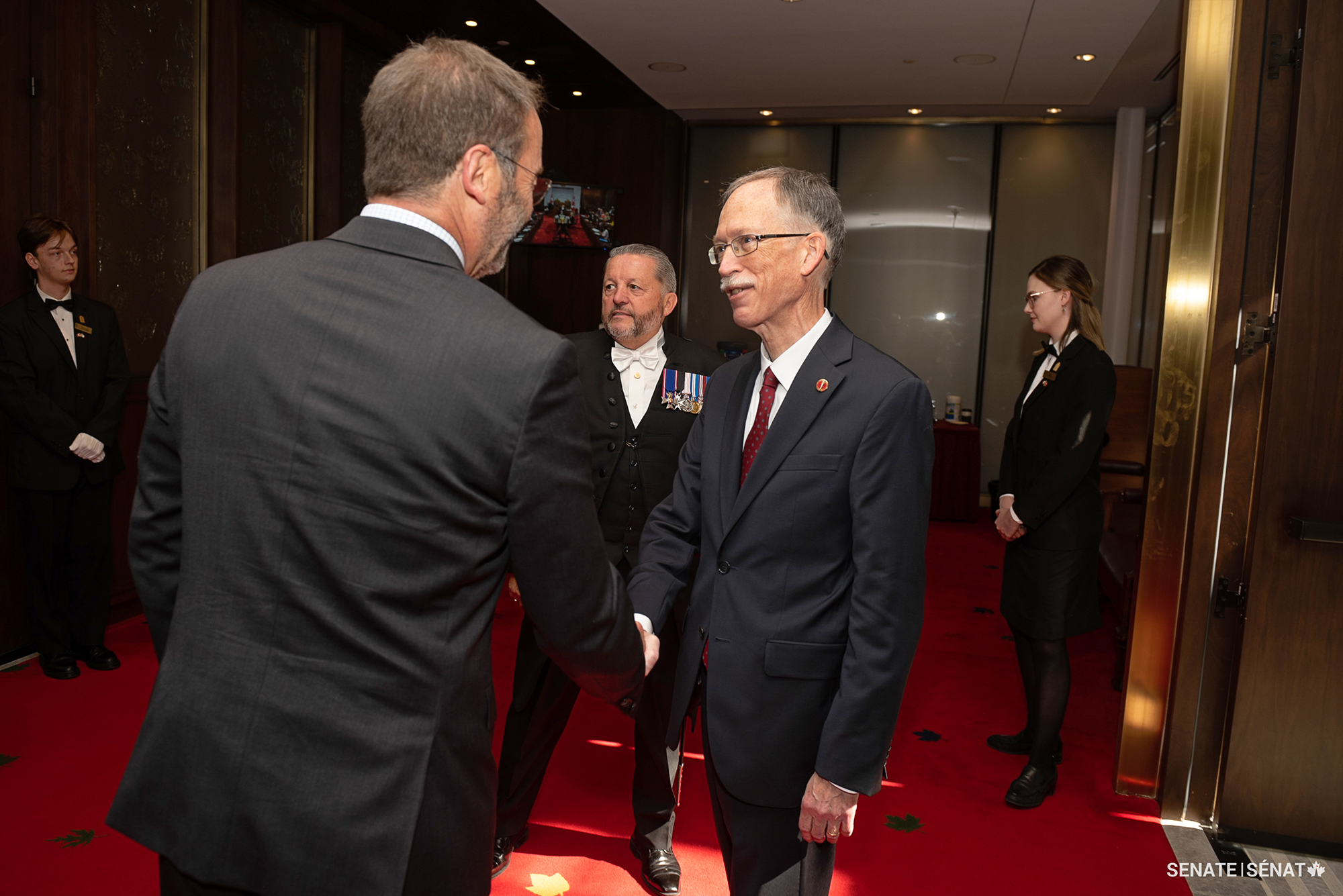 Senator Ian Shugart is welcomed to the Senate by Senator Marc Gold on September 29, 2022, the date of his swearing-in ceremony.