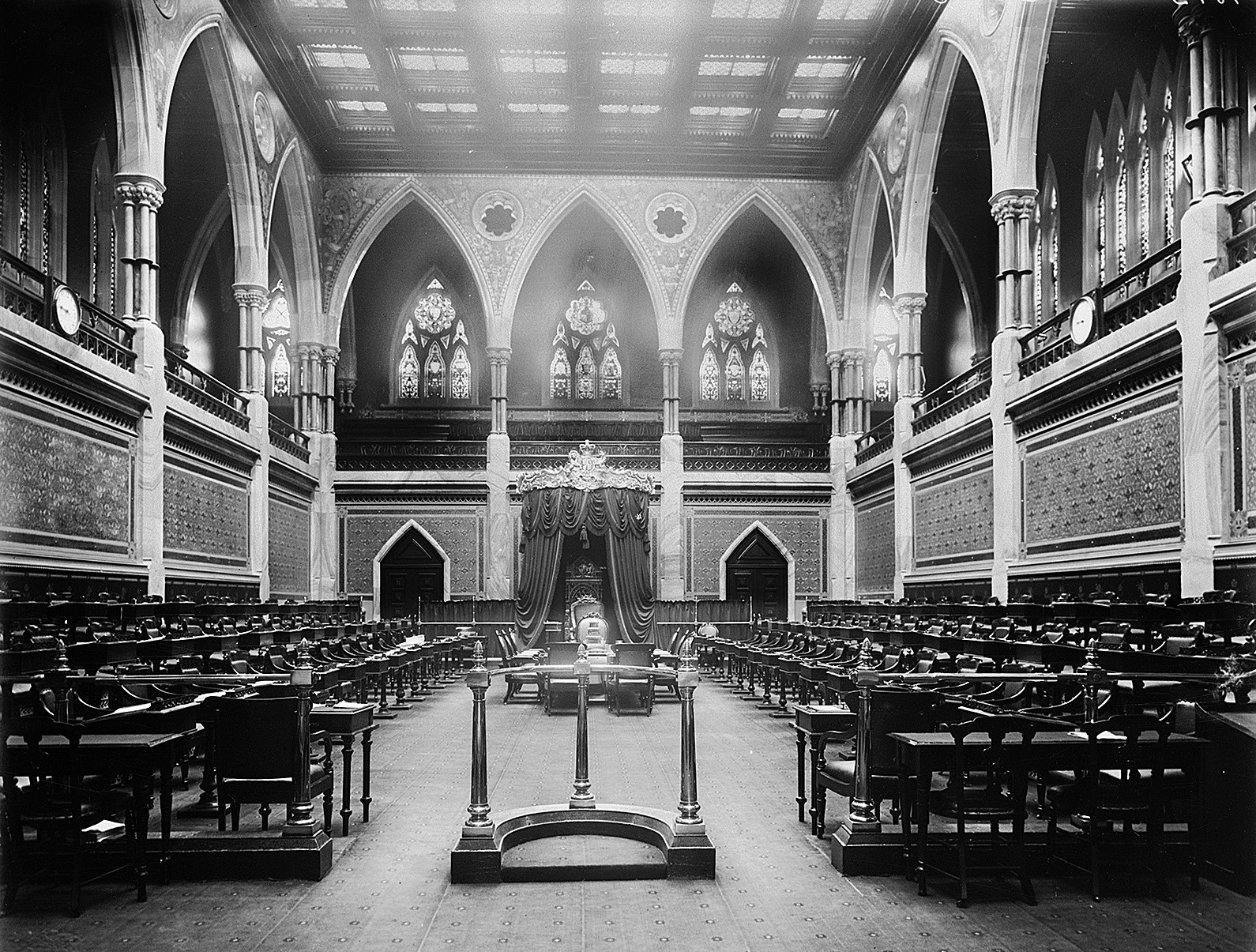 Smaller and less ornate than the permanent Senate Chamber in Centre Block, the original space was nevertheless much like what we know today.  (Photo credit: Library and Archives Canada)