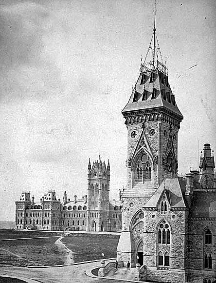 An 1868 view of Parliament Hill, showing the Parliament Building with its partially completed Victoria Tower and the newly built East Block in the foreground. (Photo credit: Library and Archives Canada)