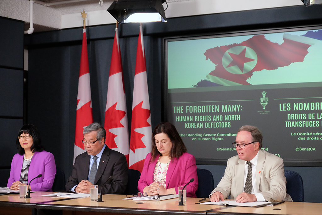 Photo, from left : Senators Yonah Martin, Thanh Hai Ngo, Salma Ataullahjan, and Jim Munson discuss the Senate Human Rights Committee’s latest report at a press conference in Ottawa.