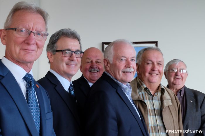 From left to right: Senator Pierre‑Hugues Boisvenu, Senator Michael L. MacDonald, Senator Terry Mercer, Tim Gilfoy, head of the Strait of Canso Superport Corporation, Frank MacInnis and Al England, both members of the Board of Directors at the Strait of Canso Superport Corporation.