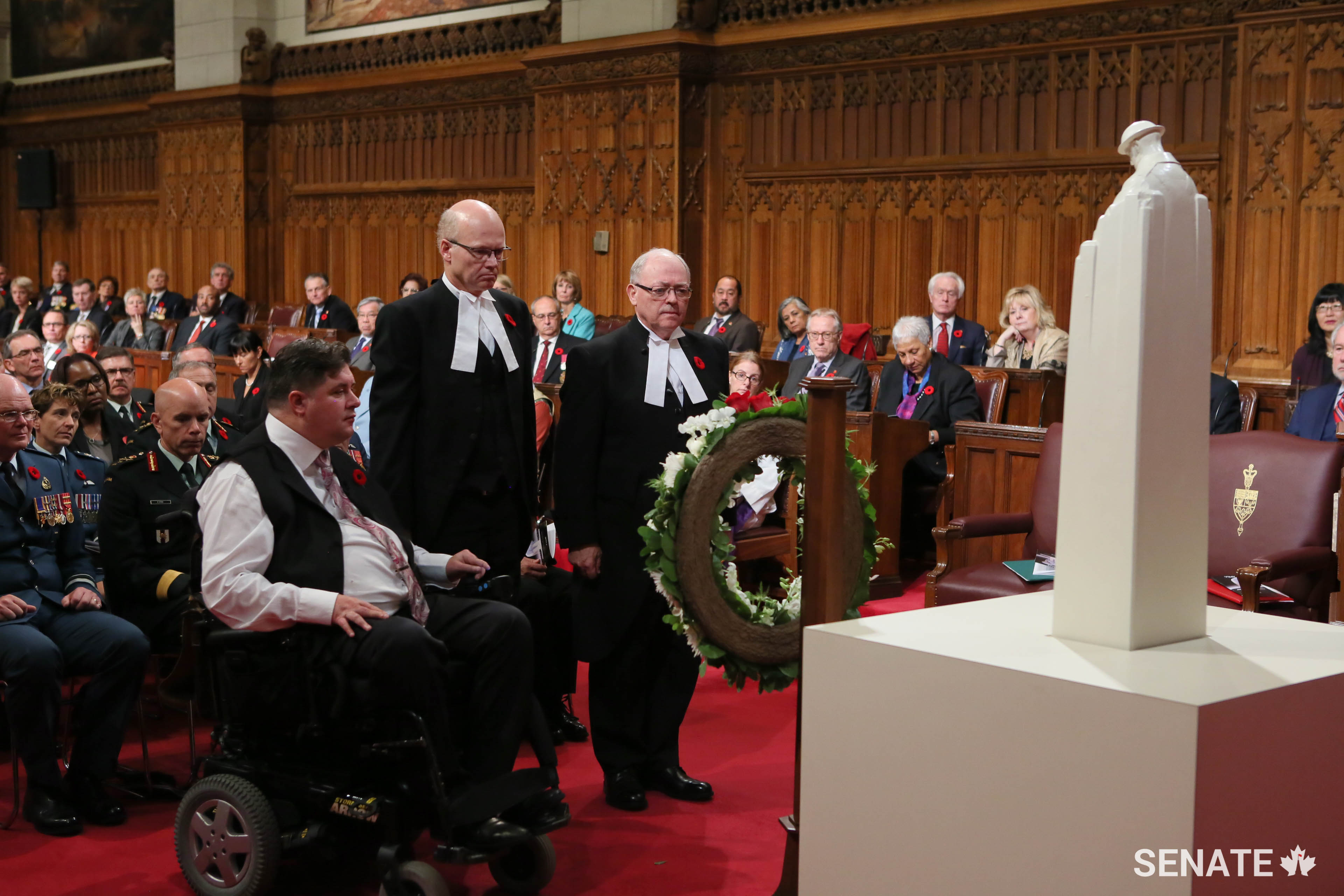 Right to left: Senate Speaker George J. Furey, House Speaker Geoff Regan and Minister of Veterans Affairs Kent Hehr lay a wreath.