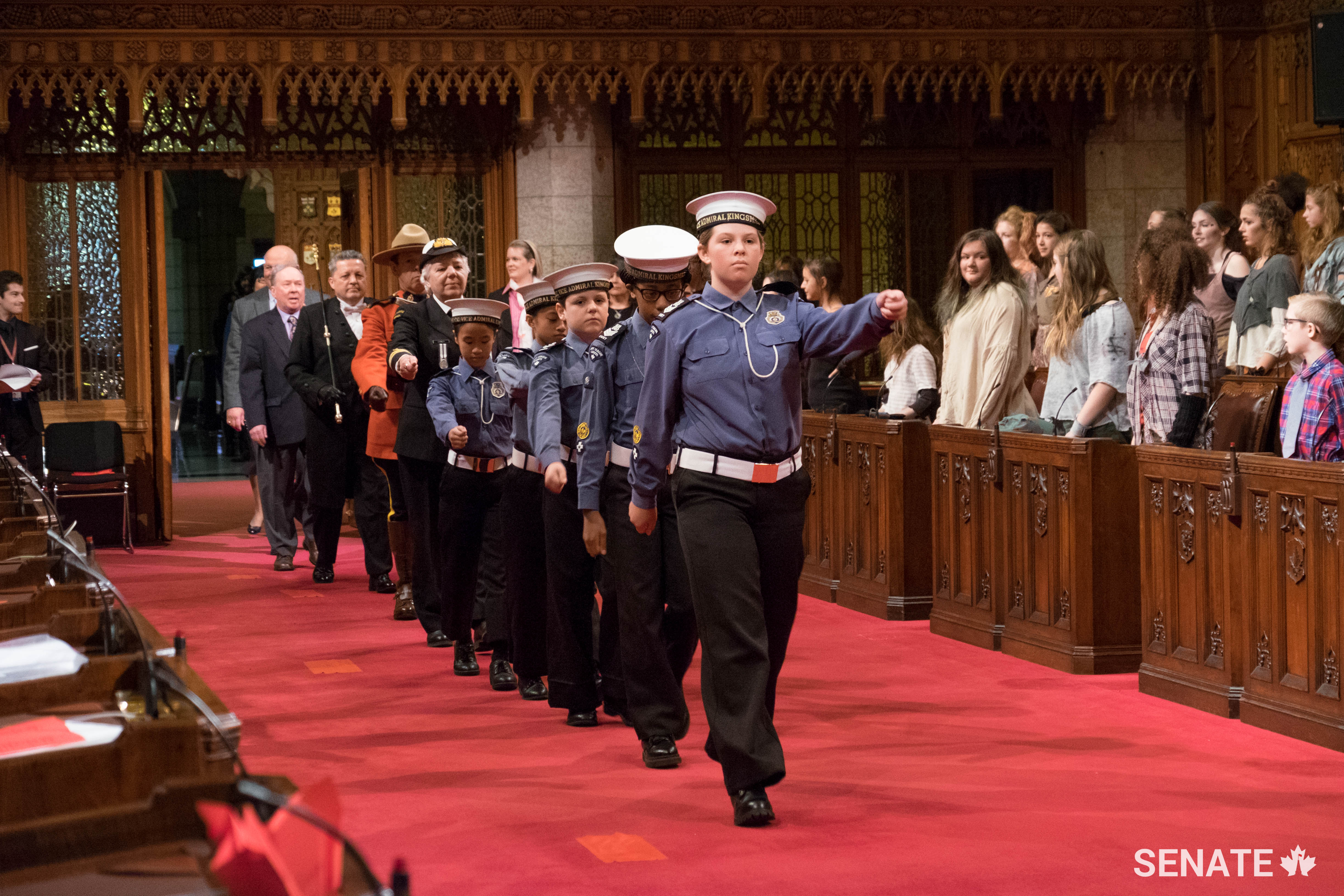 Pictured: Cadets lead the way into the Senate chamber.