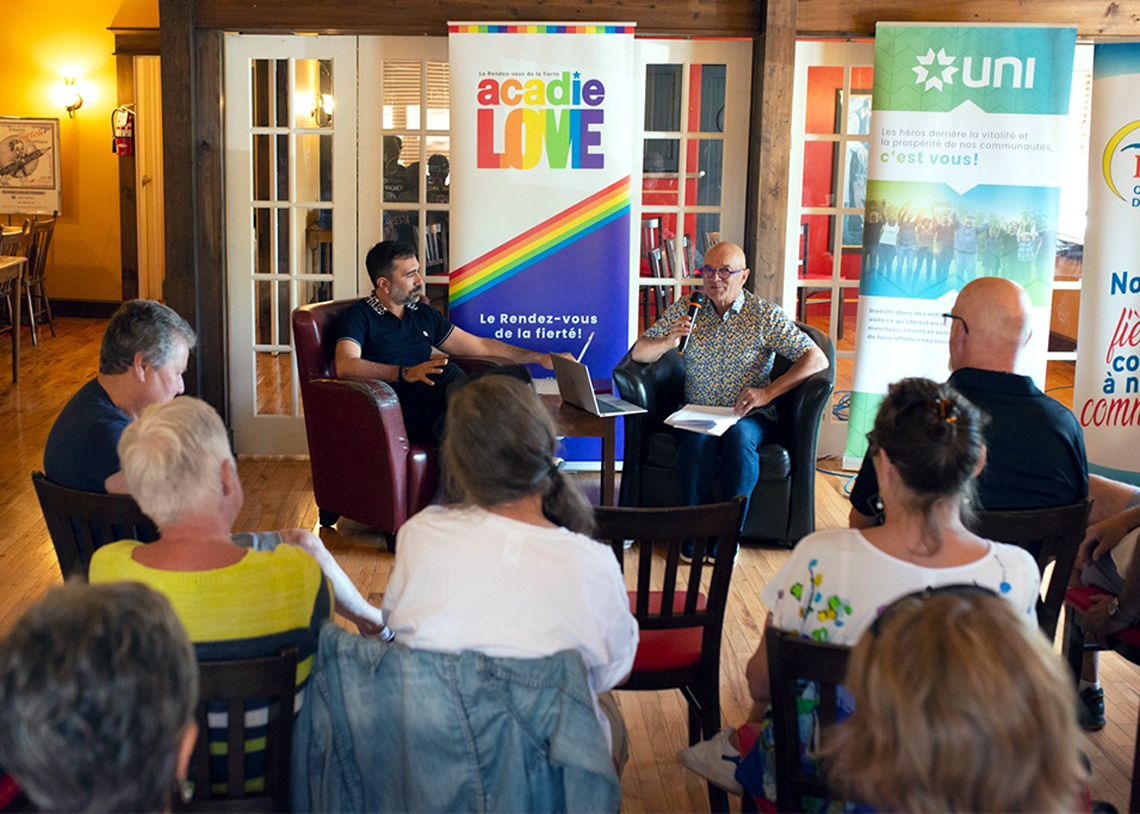 Friday, July 15, 2022 – As part of Le Rendez-vous de la Fierté Acadie Love (in French only) in Caraquet, New Brunswick, Senator René Cormier (right) and Silvan Agius, a European Human Rights expert, engage in a candid conversation on the disparities between the everyday experiences of LGBTQ2, cisgender and heterosexual people at different points in their lives and in different social contexts. A fruitful exchange with the audience also took place, in which everyone reflected on their personal experiences and the changes they wish to see in society.