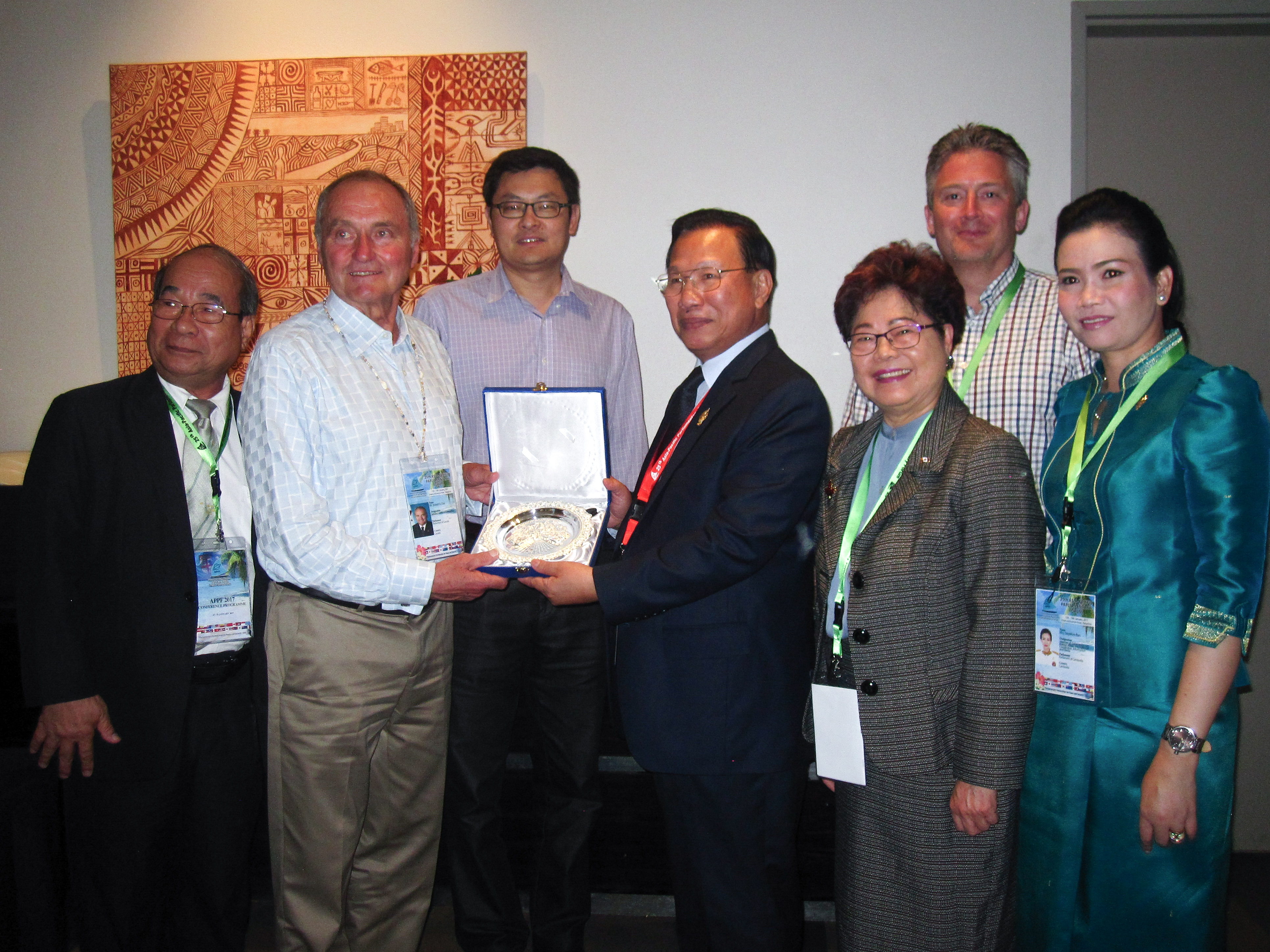 During a bilateral meeting, the Canadian delegation receives a gift from parliamentary delegates from Cambodia to the APPF.