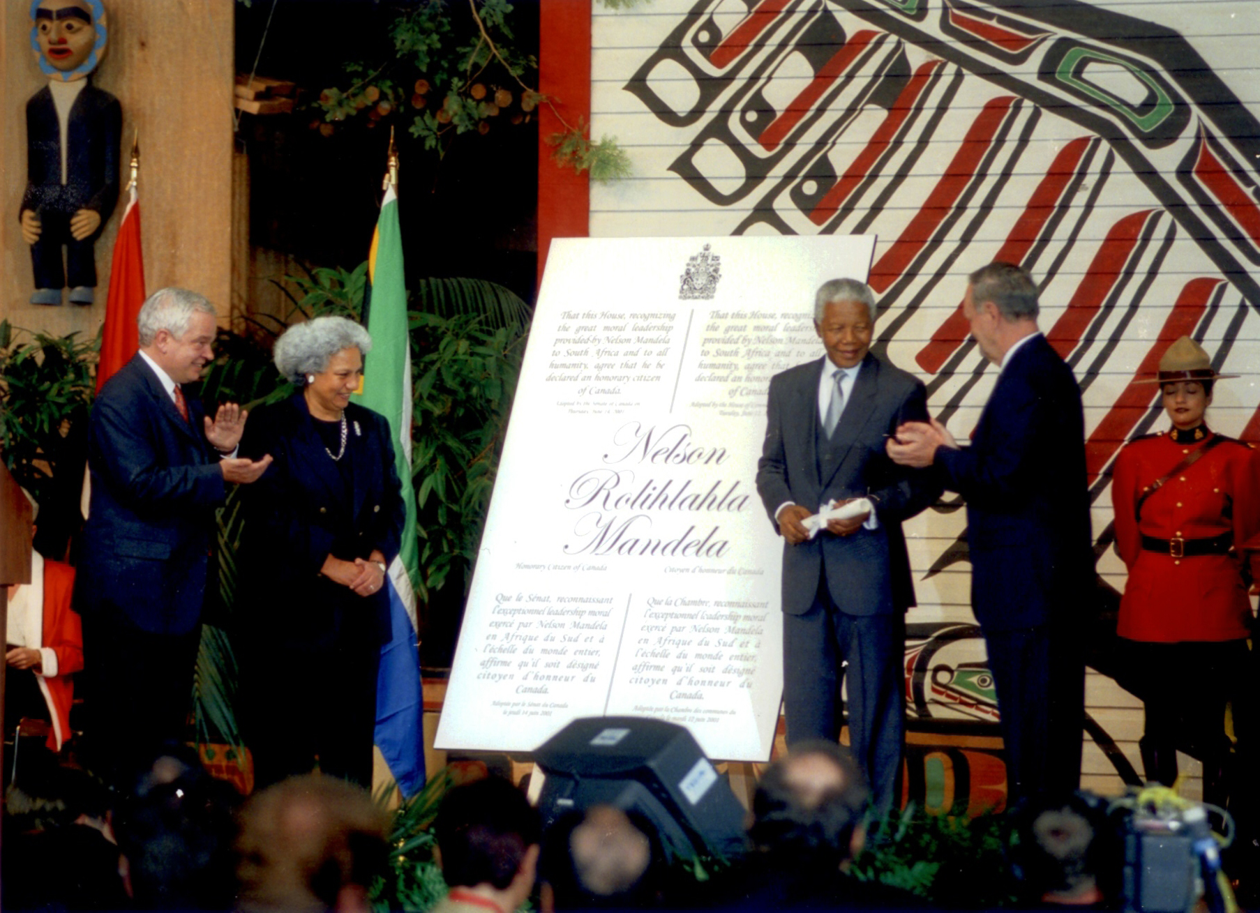 Senator Cools, with Member of Parliament John McCallum (far left) and Prime Minister Jean Chrétien (far right), bestows honorary Canadian citizenship on Nelson Mandela in 2001.