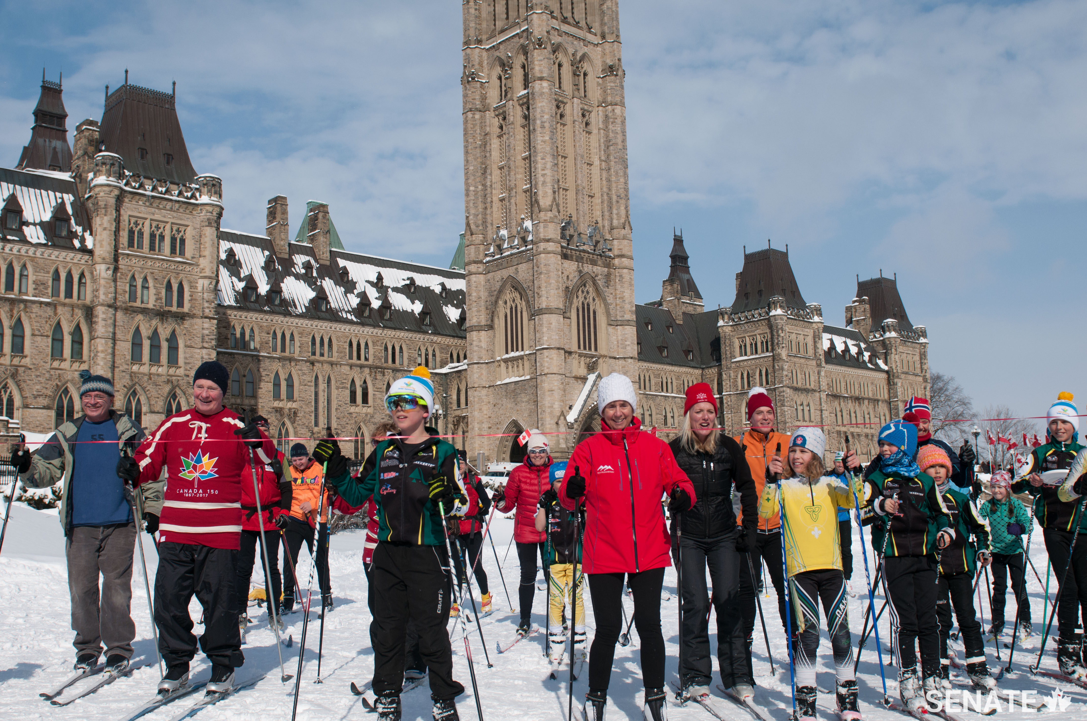 Governor General David Johnston joined a group of dignitaries and children for Ski Day on the Hill. Also taking part were Senators Raine and Patterson, Federal Environment Minister Catherine McKenna and Norwegian Ambassador Anne Ovind. The group is shown here arriving at the finish line on Parliament Hill’s west lawn.