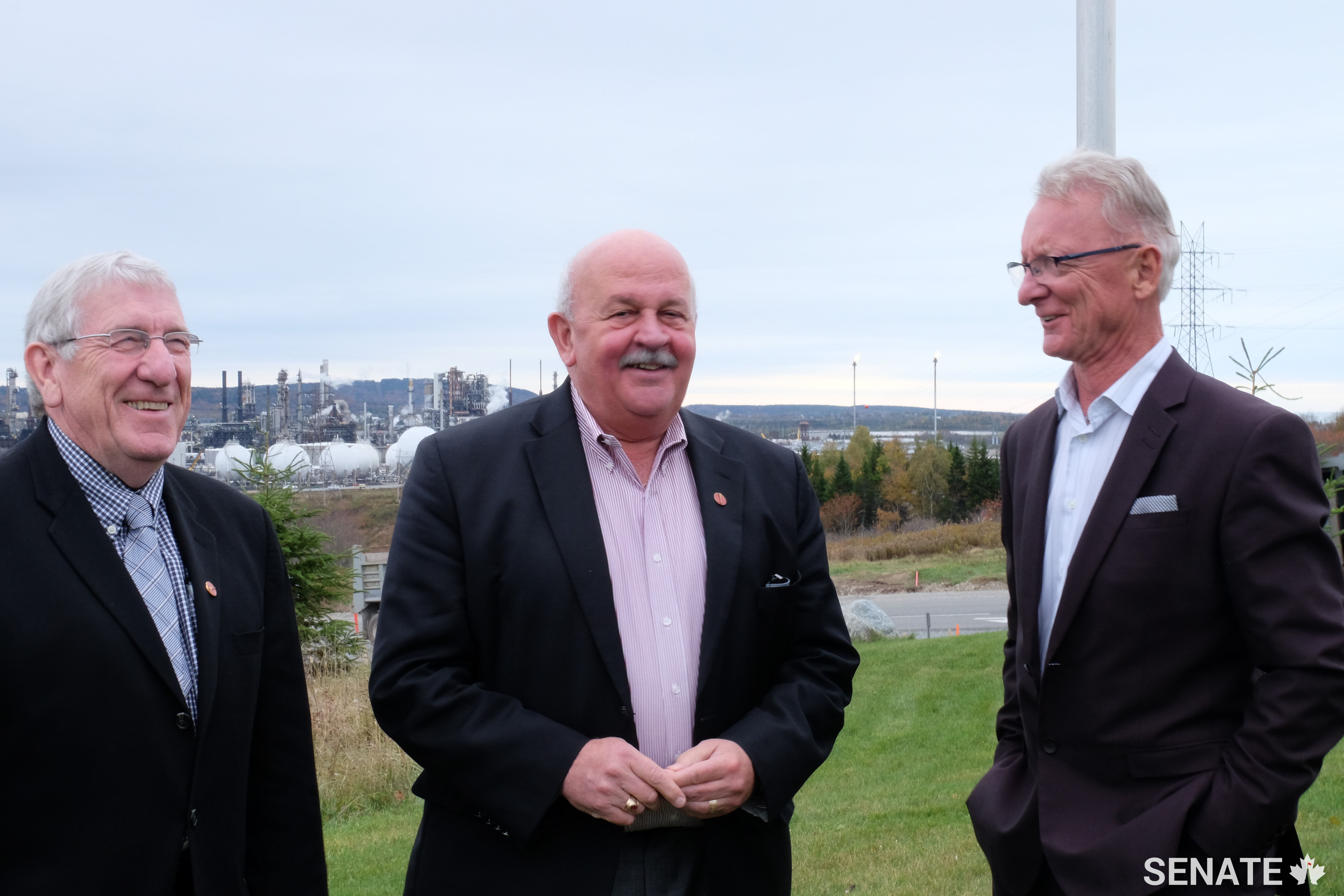 Left to right: Senators Doyle, Mercer and Boisvenu share a moment during a fact-finding mission on pipelines.