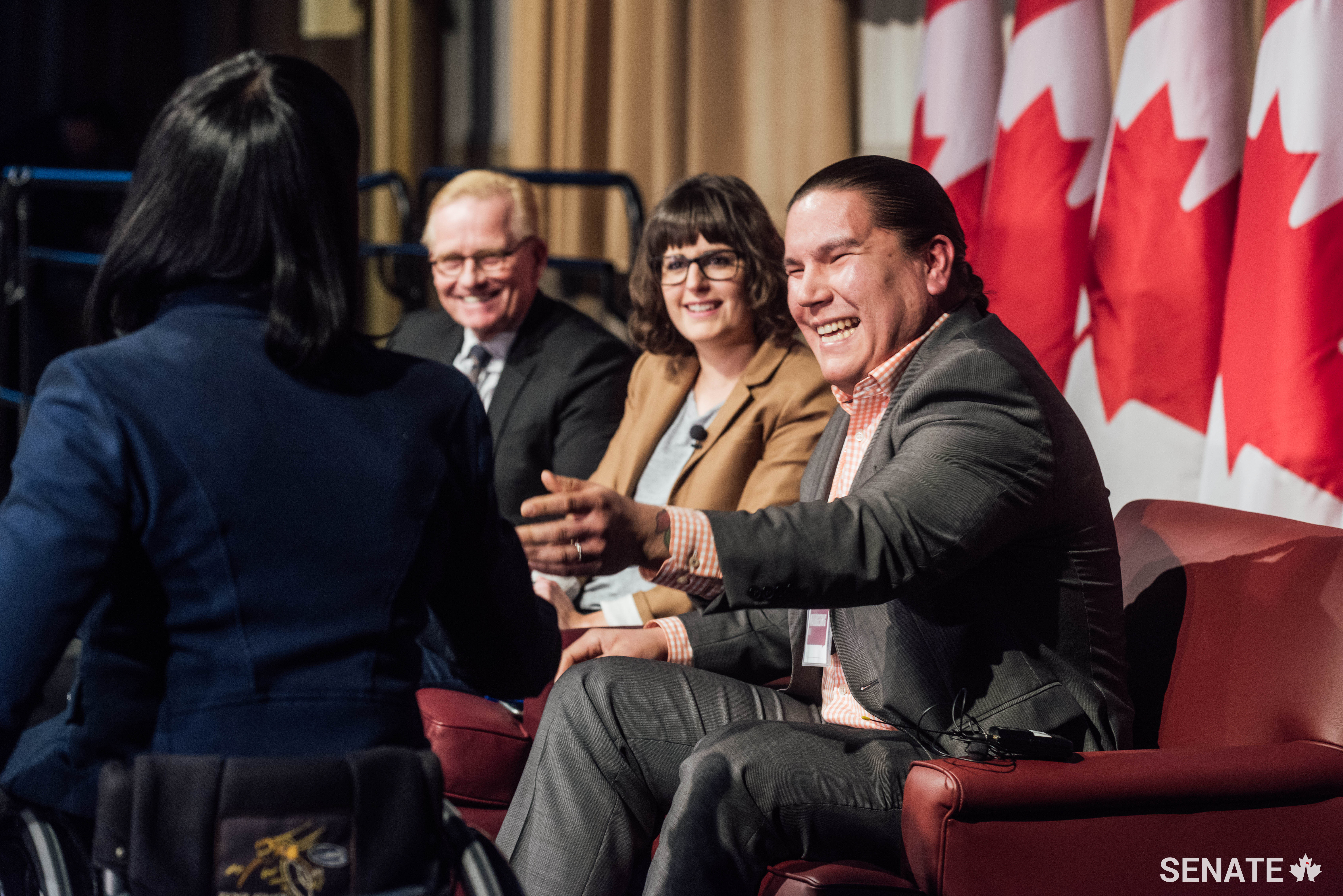 Media panelists share a joke with Senator Petitclerc. The panel included (from right) CBC’s Waubgeshig Rice, Le Devoir’s Marie Vastel and the Globe and Mail’s Robert Fife.