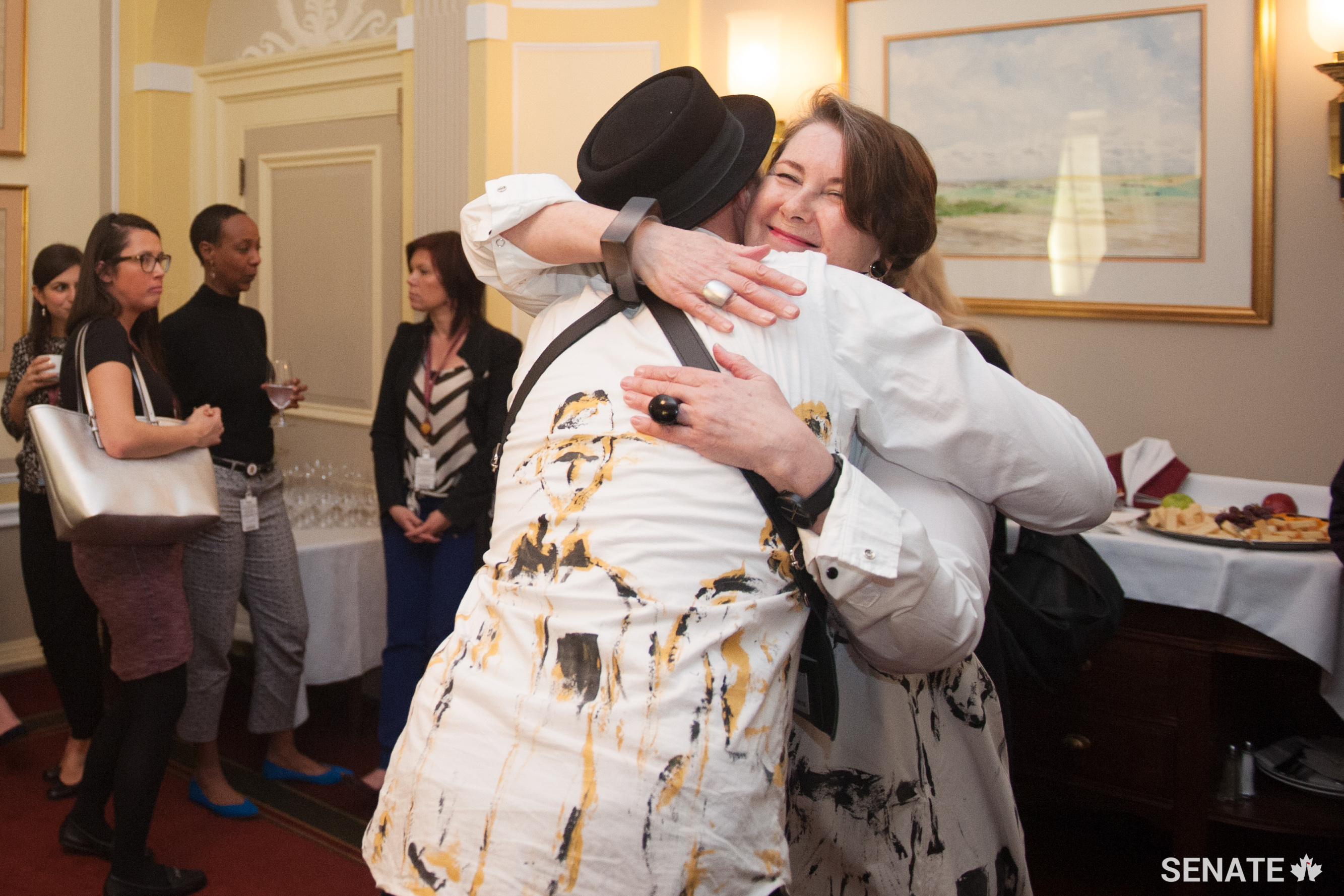 Two Manitobans — Winnipeg artist Lennard Taylor and Senator Marilou McPhedran — shared an embrace in Ottawa.