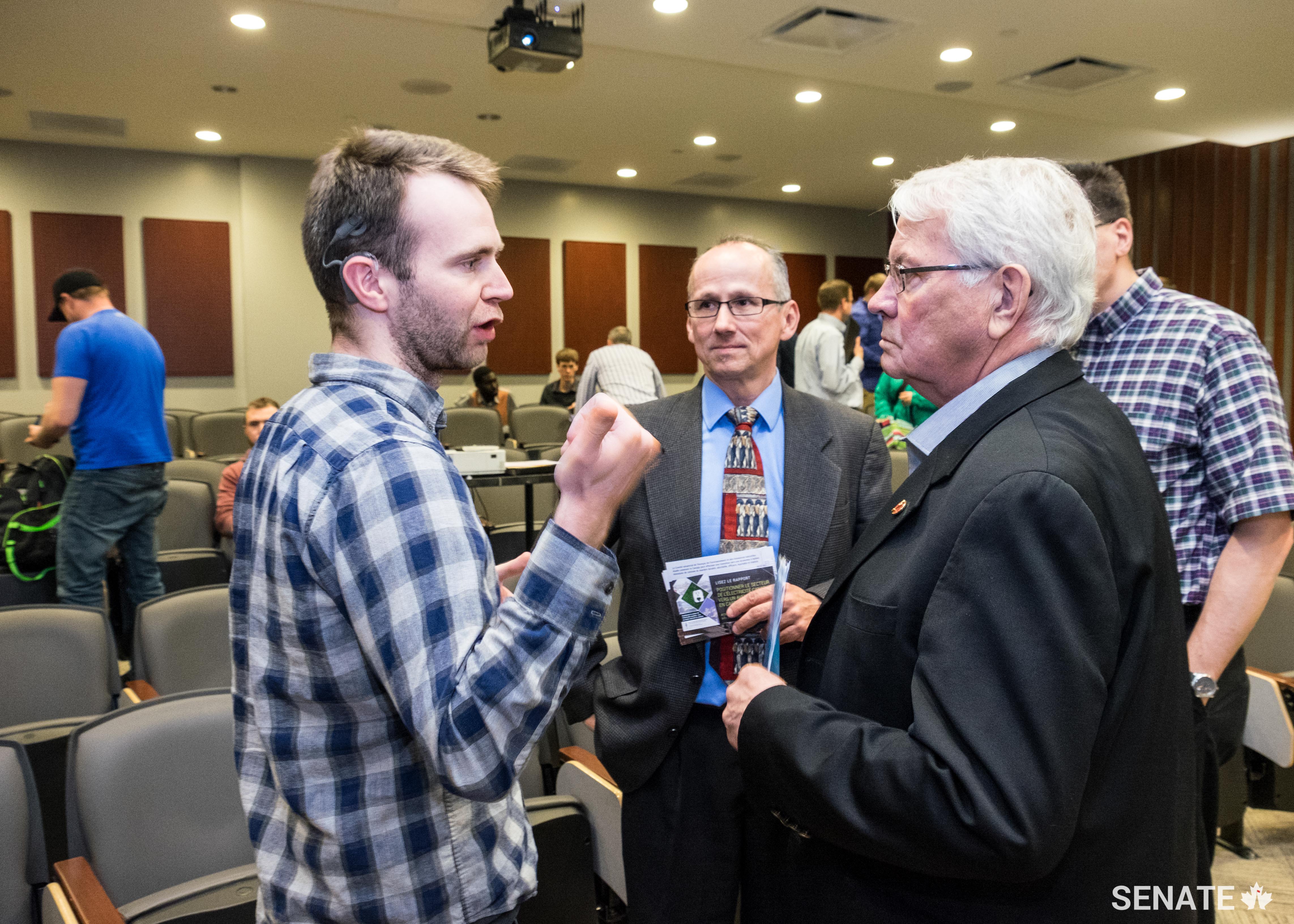 Peter Clifford, a student in instrumentation control technology, speaks to Senator Neufeld after his presentation to New Brunswick Community College students.