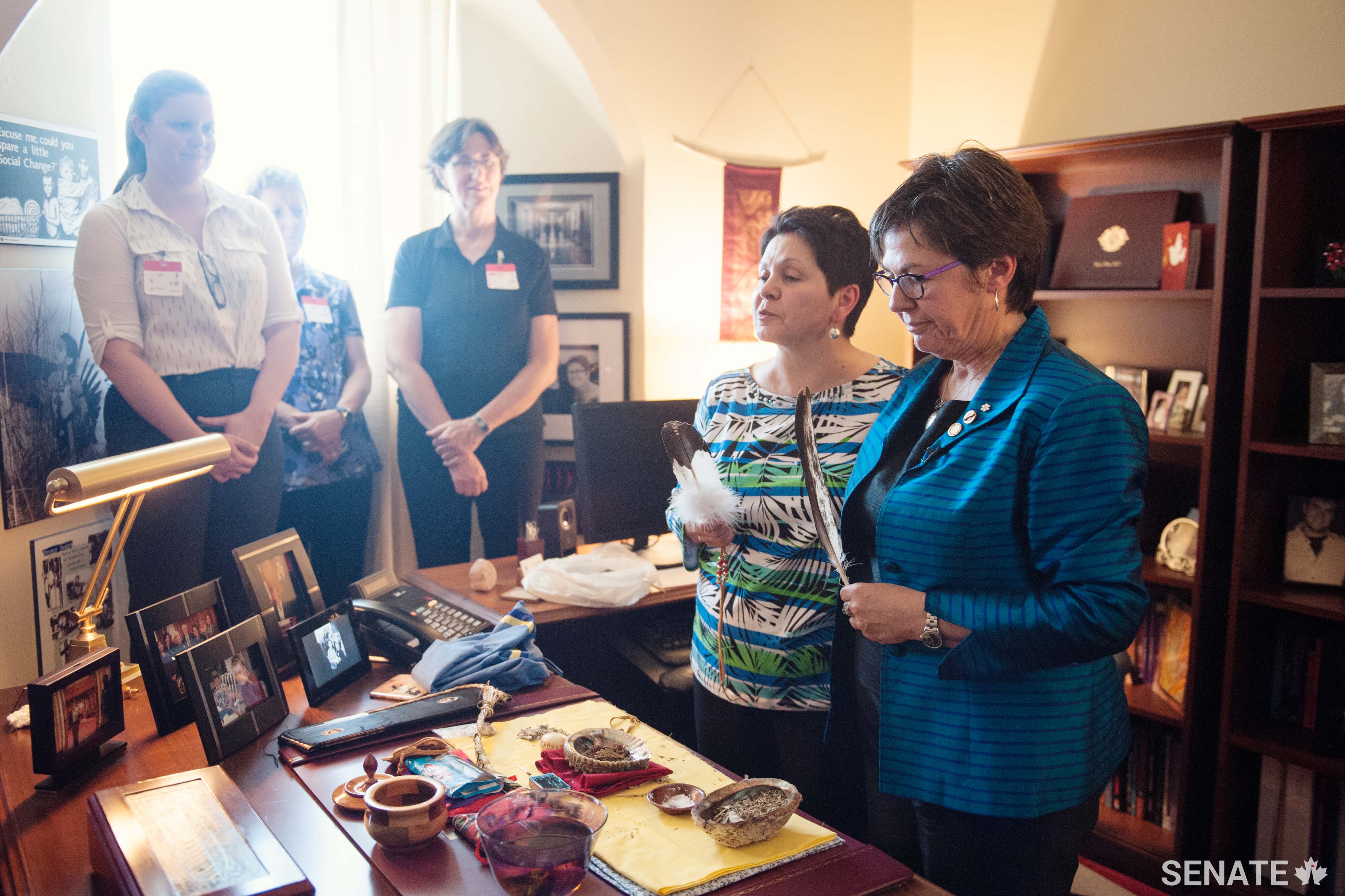 Senator Kim Pate holds a traditional smudging ceremony in her office on Parliament Hill. Senator Pate is a member of the Senate Committee on Aboriginal Peoples.
