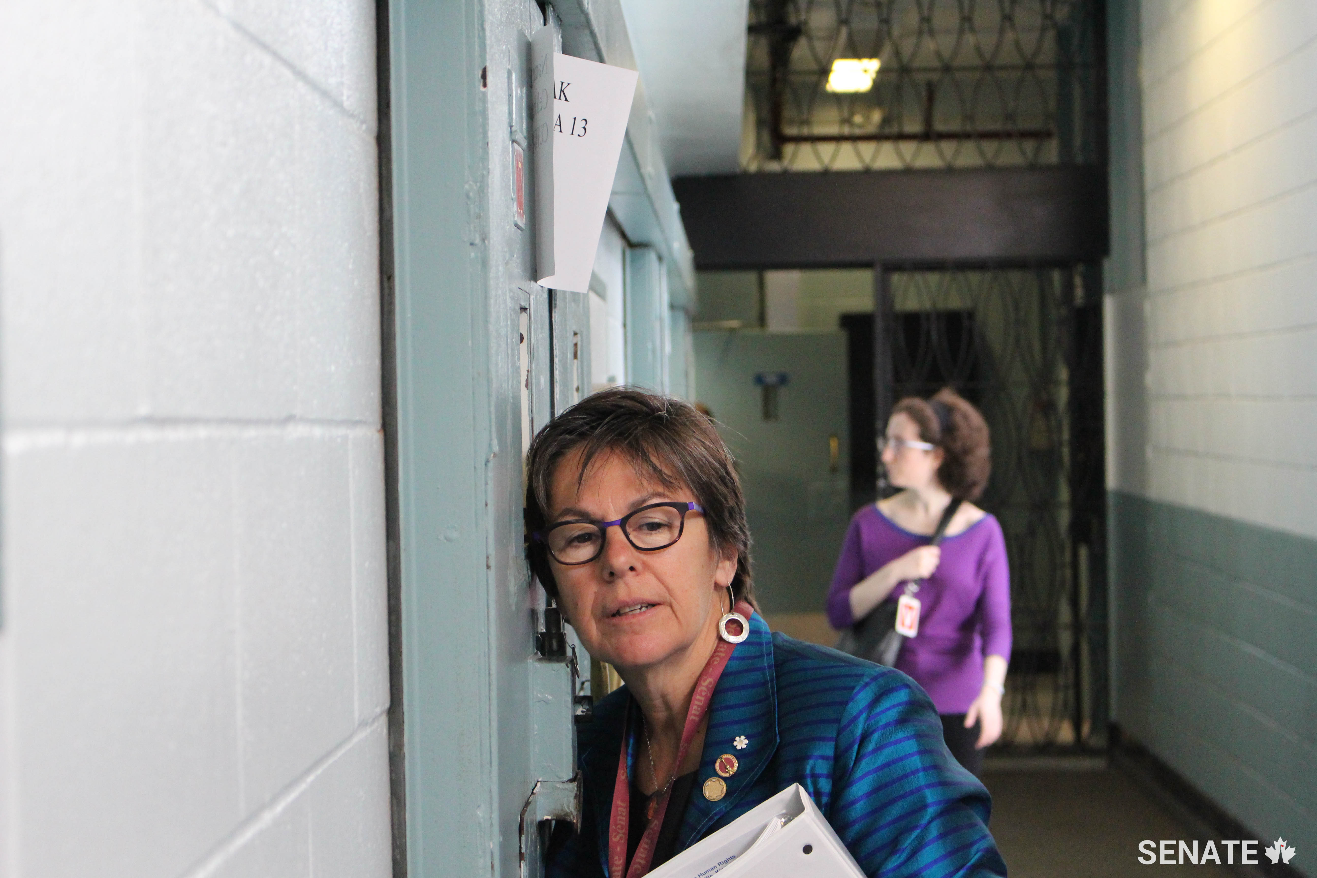 Senator Kim Pate listens to a man being held in the segregation unit at Millhaven Institution, a prison near Kingston, Ontario.