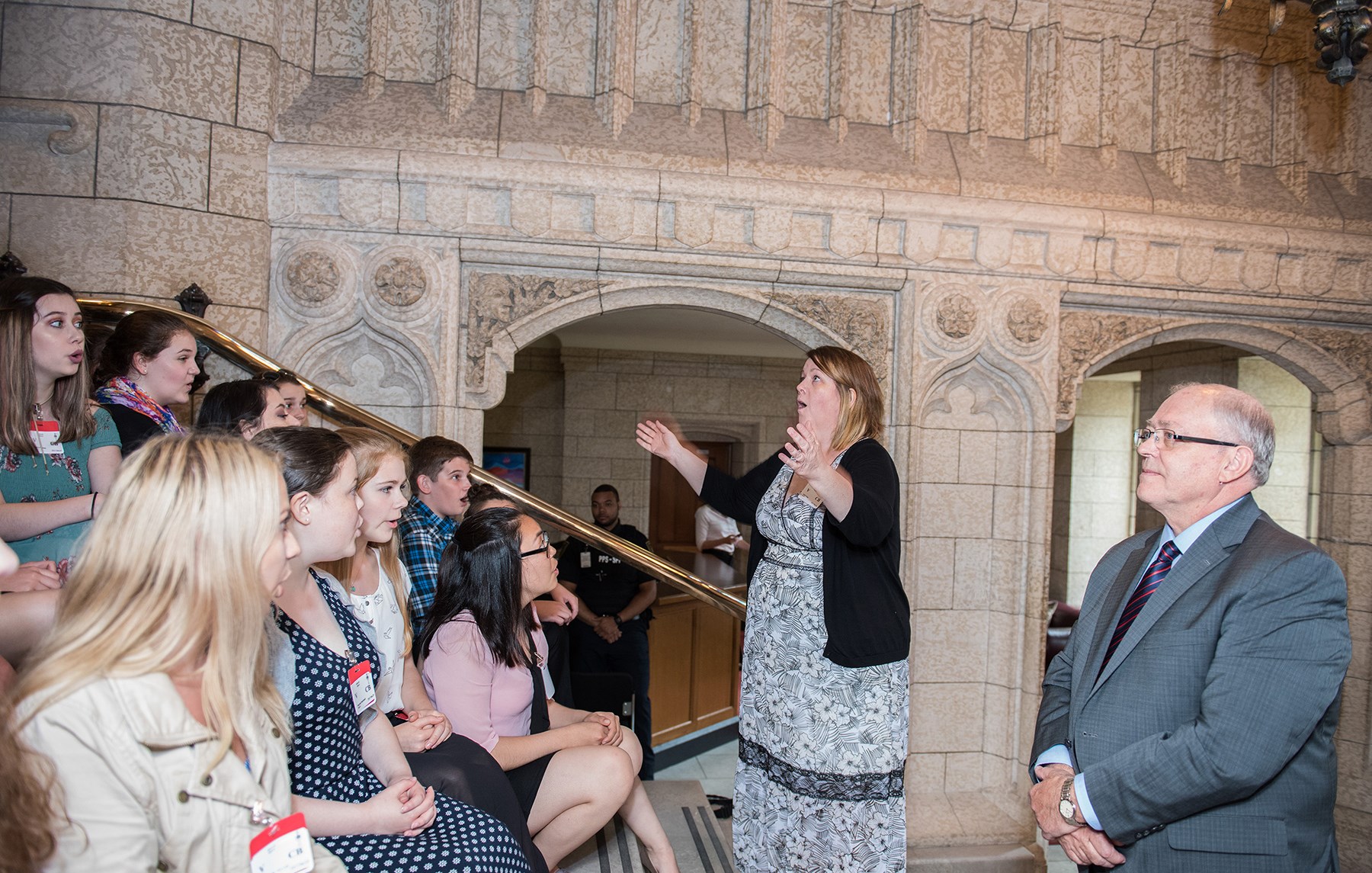 At the steps leading to the Senate, Kellie Walsh, Artistic Director of Shallaway, conducts a performance of the “Ode to Newfoundland” and a rendition of “O Canada” sung in Inuktitut.