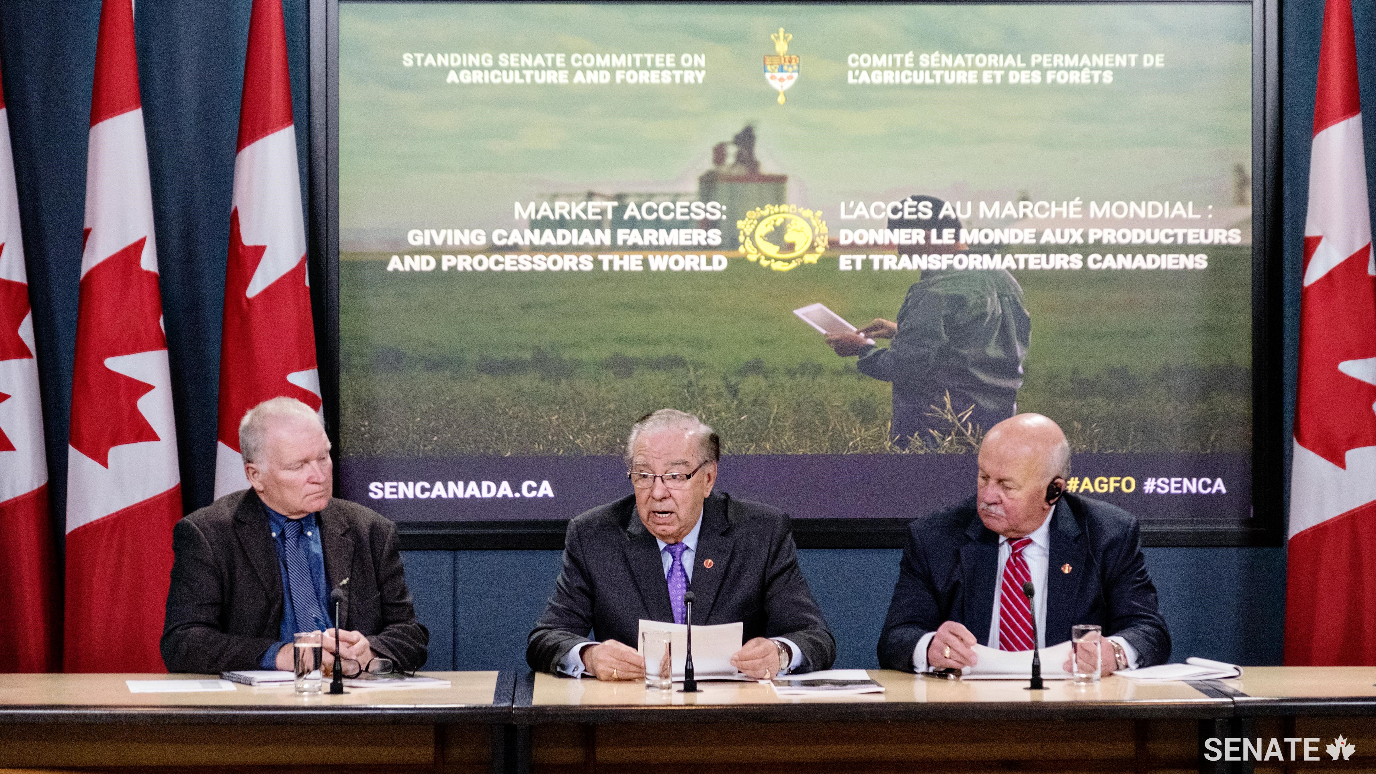 Canadian Federation of Agriculture president Ron Bonnett (left) joins Senate Committee on Agriculture and Forestry chair Senator Ghislain Maltais and deputy chair Senator Terry Mercer on May 9, 2017 as they release a report on improving Canadian farmers’ access to international markets.