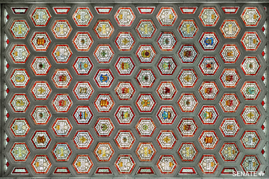 The foyer's stained-glass ceiling features symbols of the European cultures that contributed to Canada’s founding: the Irish shamrock, the French fleur-de-lis, the Scottish thistle, the Welsh dragon and the English lion.