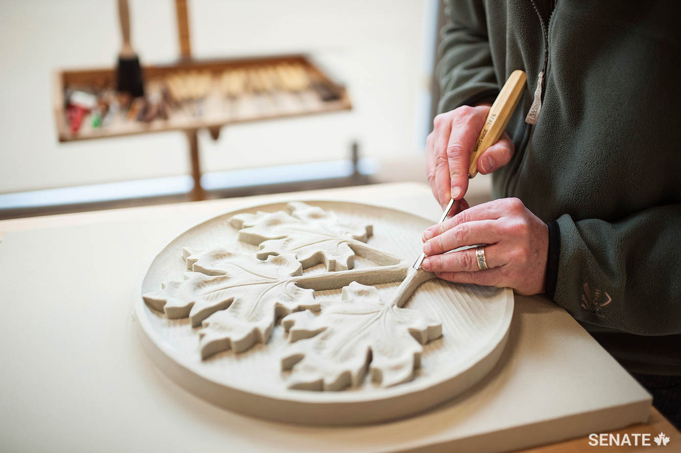 Mr. White works on a maple-leaf design for bronze plaques that will be cast for the walls of the interim Senate chamber in the Government Conference Centre.