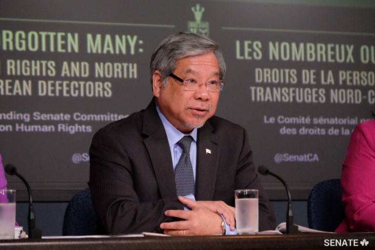 Senator Ngo speaking at a press conference of the Standing Committee on Human Rights on the topic of “<a href='https://sencanada.ca/content/sen/committee/421/RIDR/reports/RIDR-NorthKoreanDefectors_e.pdf'>The Forgotten Many: Human Rights and North Korean Defector</a>” (2016)