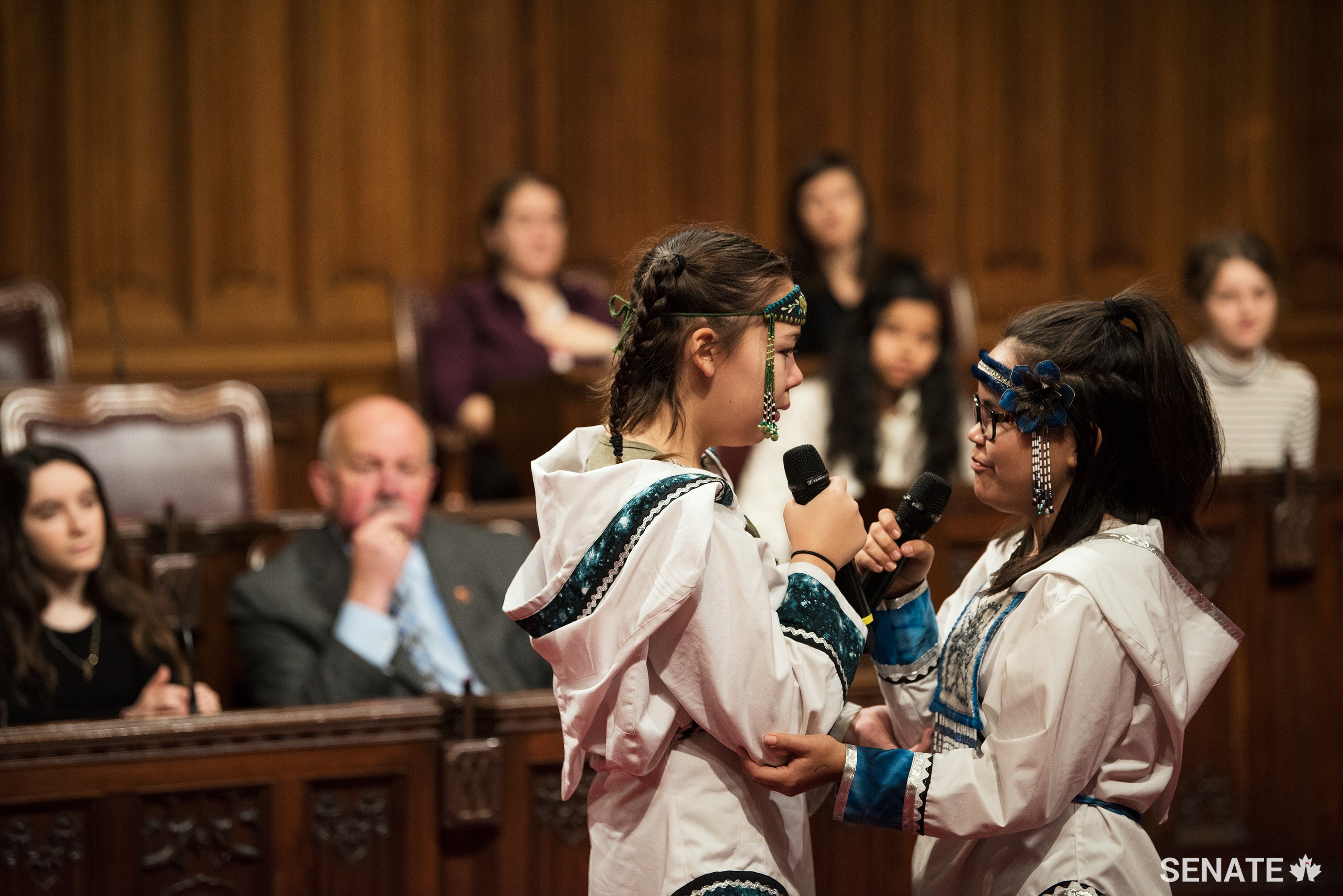 Inuit throat singers Cailyn DeGrandpre, left, and Samantha Kigutak-Metcalfe try to make each other laugh during a performance.