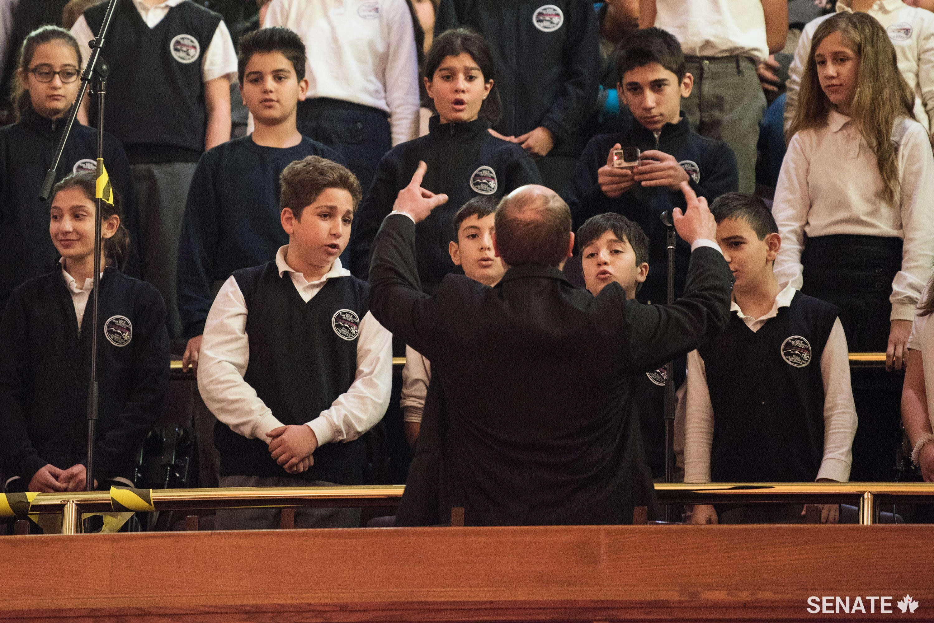 Members of Montreal’s Alex Manoogian school choir sing the National Anthem.