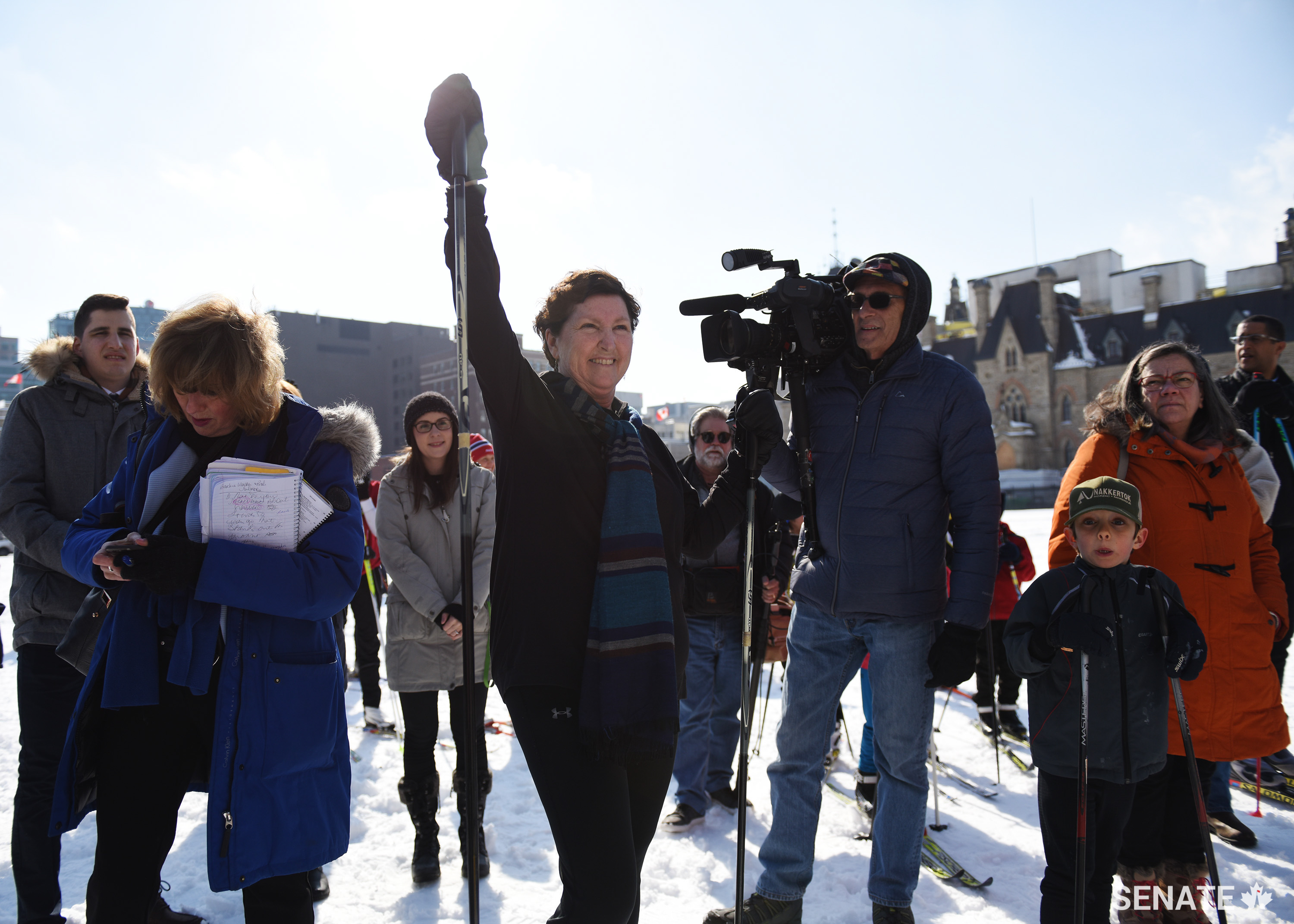 Senator Mary Coyle clips on her skis and gets ready to race around the west lawn of Parliament Hill.