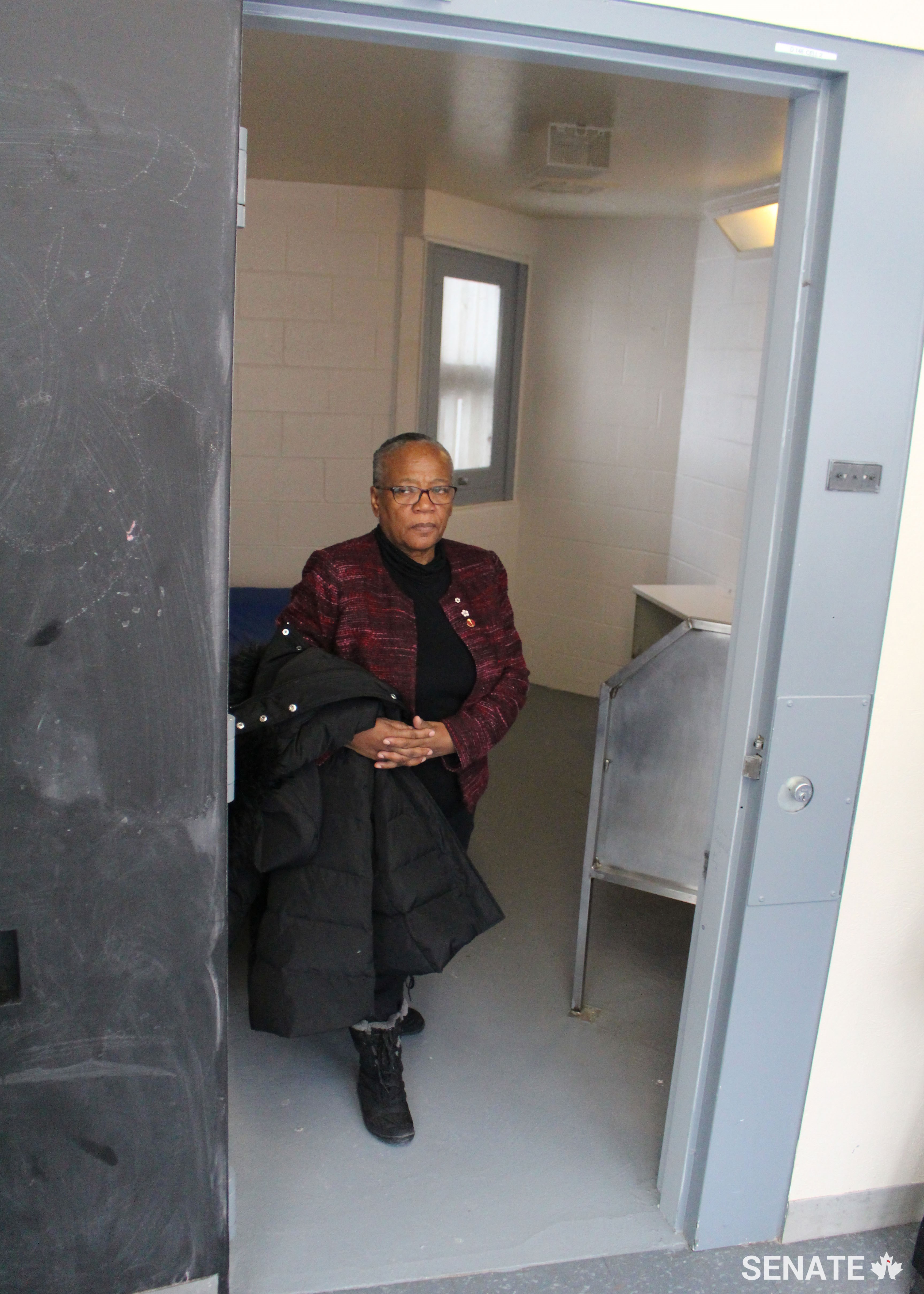 Senator Wanda Thomas Bernard, chair of the Senate Committee on Human Rights, leaves a cell in the segregation area of the Grand Valley Institute for Women during a fact-finding mission on February 9, 2018.