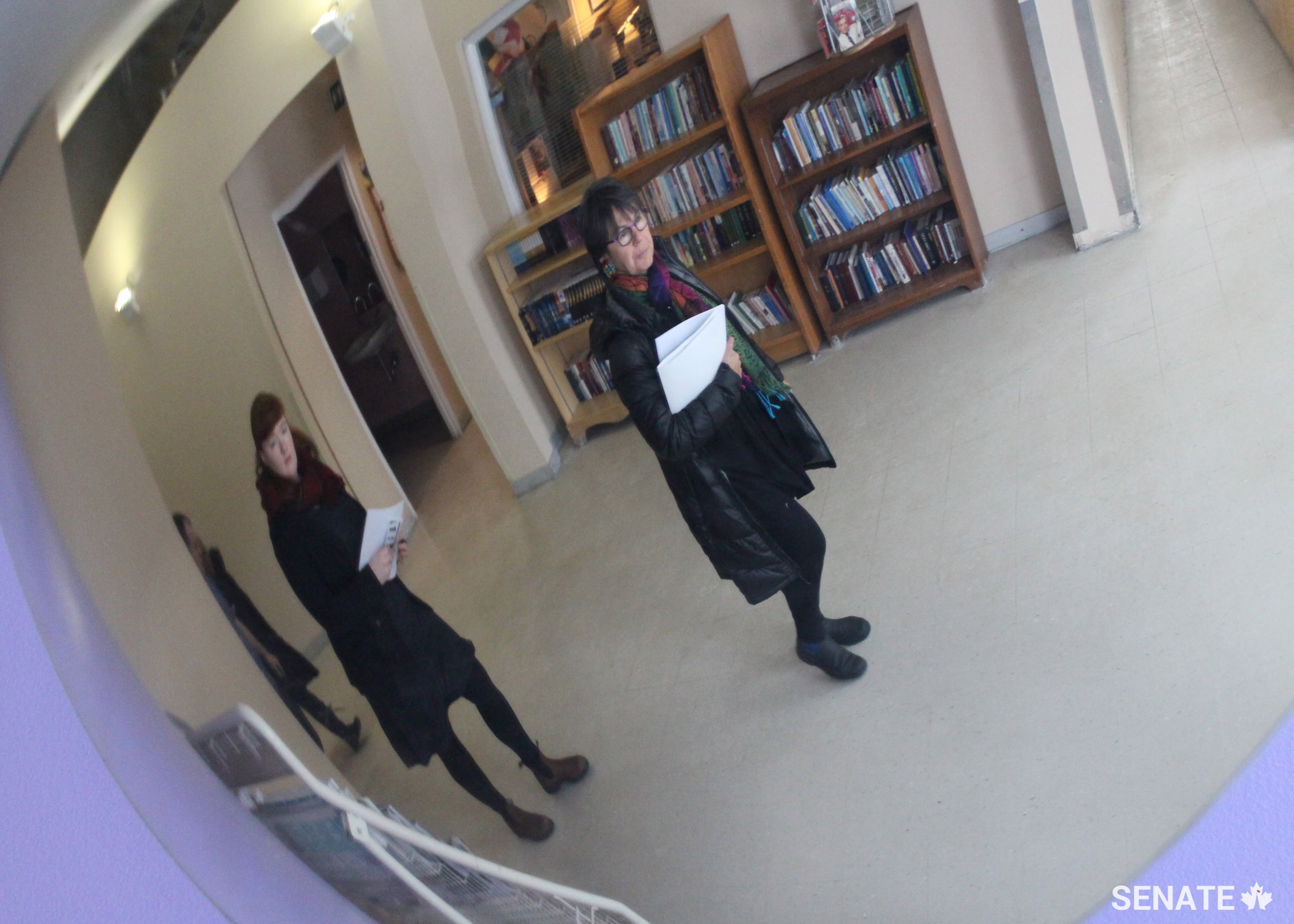 Senator Kim Pate is reflected in a security mirror during a fact-finding mission to the Grand Valley women's prison.