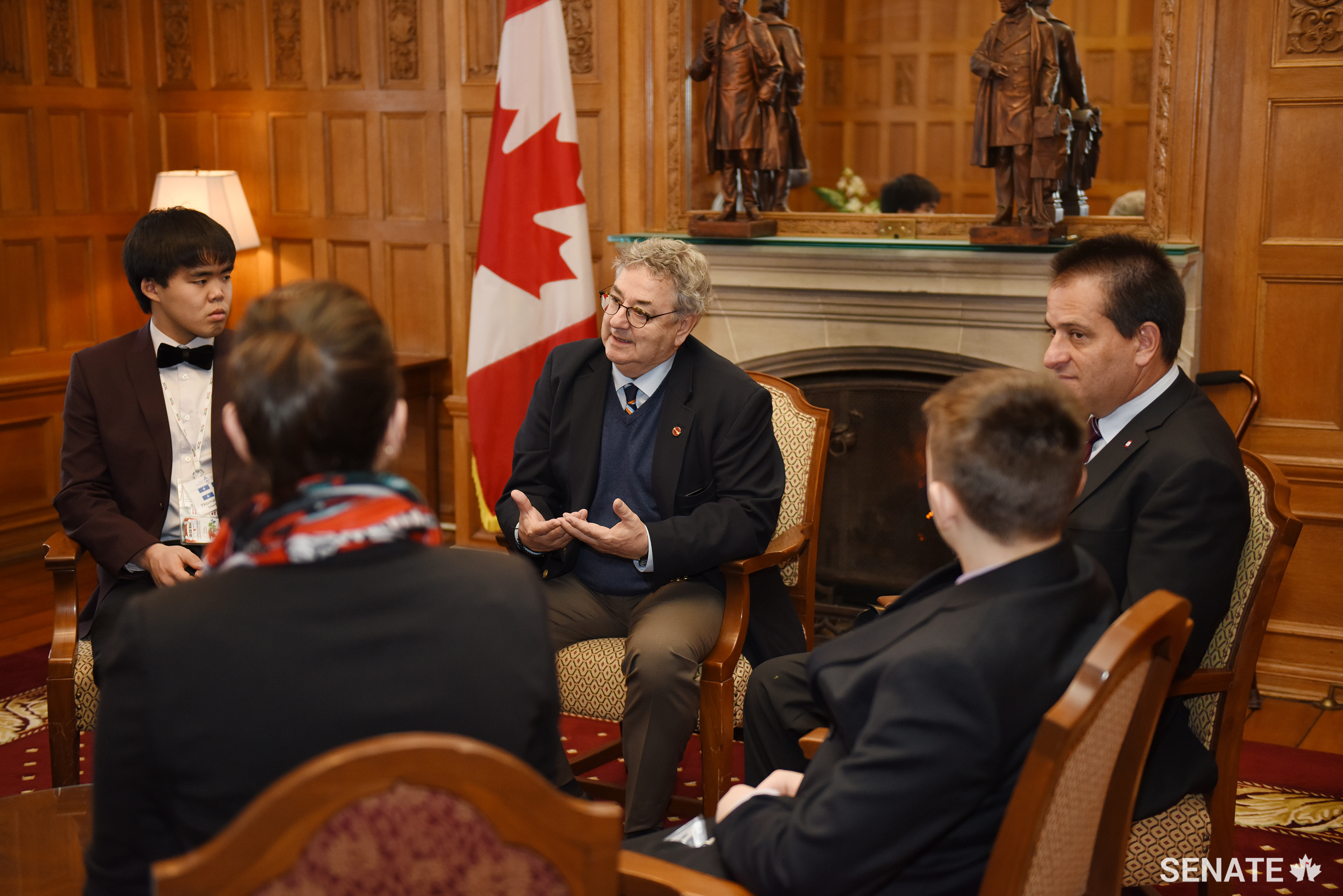 Senator Forest speaks with <a href='https://sencanada.ca/en/sencaplus/news/senate-continues-partnership-with-forum-for-young-canadians/'>Forum for Young Canadians</a> participants about the importance of getting involved in one's own community in February 2018.