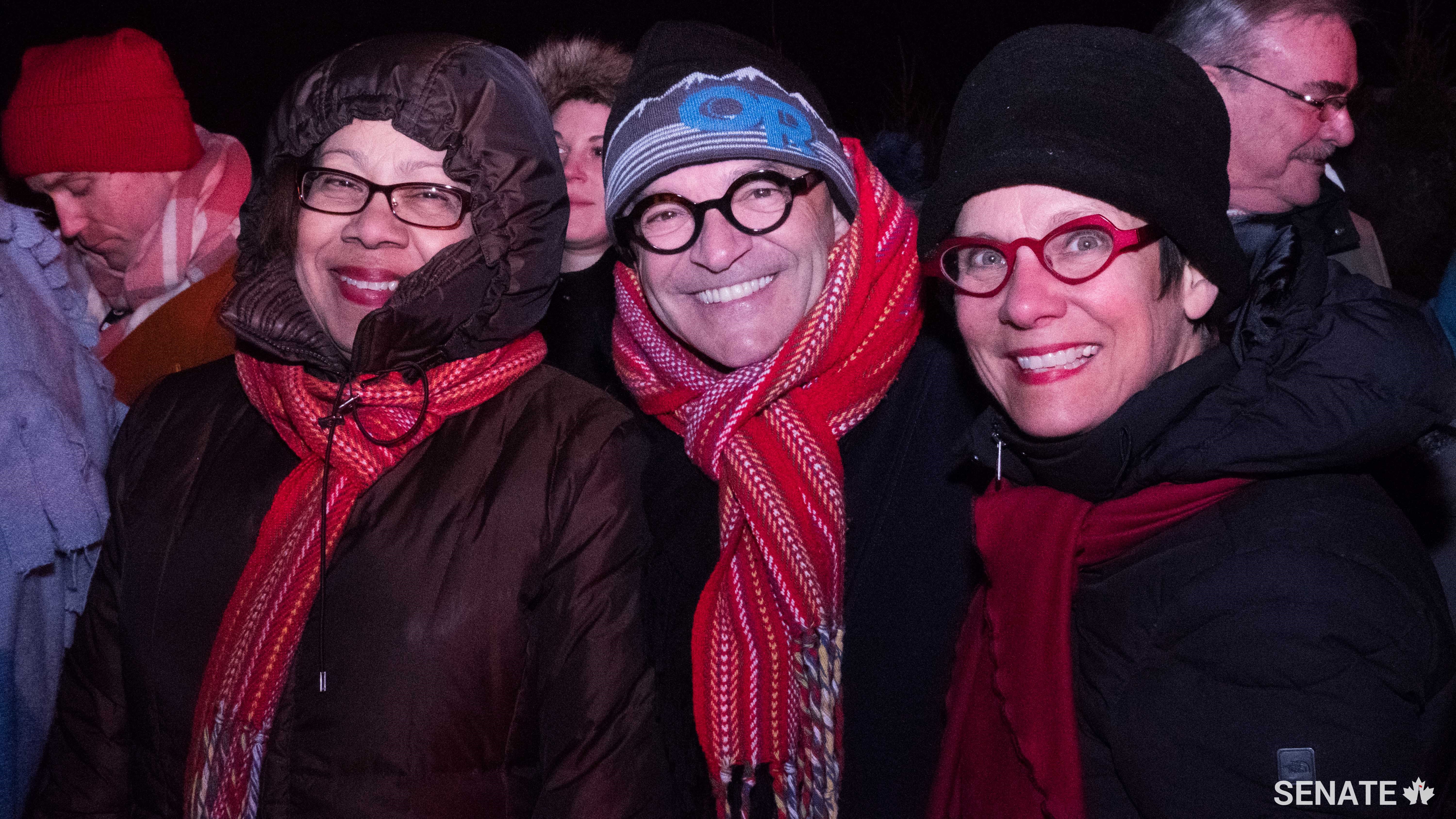 Senators Marie-Françoise Mégie, René Cormier and Raymonde Gagné take in the Festival du Voyageur, in Winnipeg.