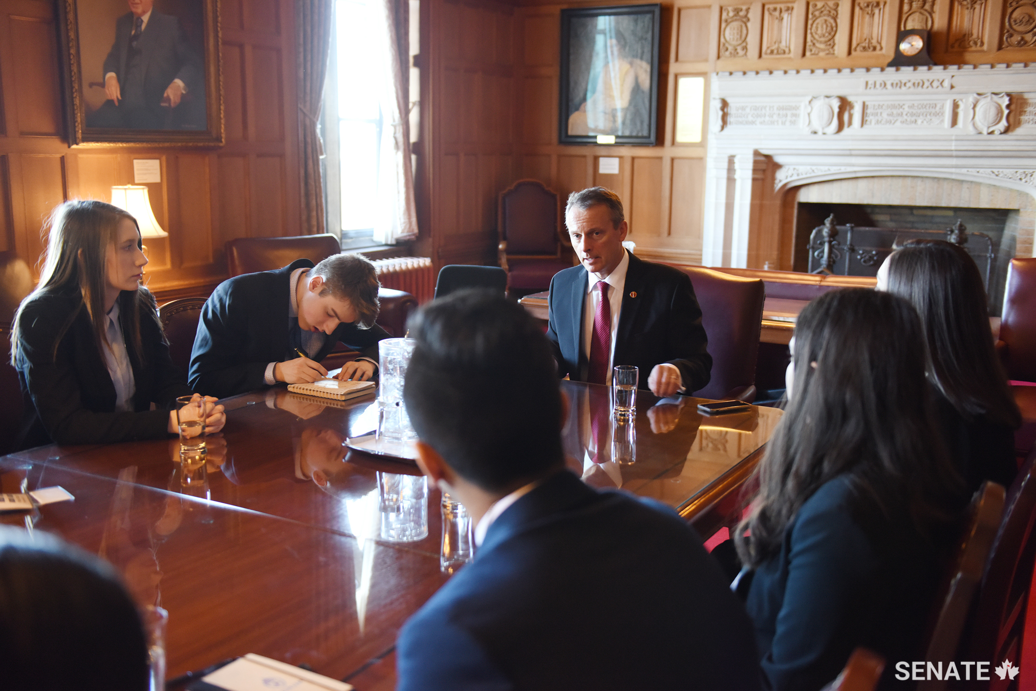 Senator David M. Wells discusses the role of the Senate within Parliament during a break-out session with Forum participants.
