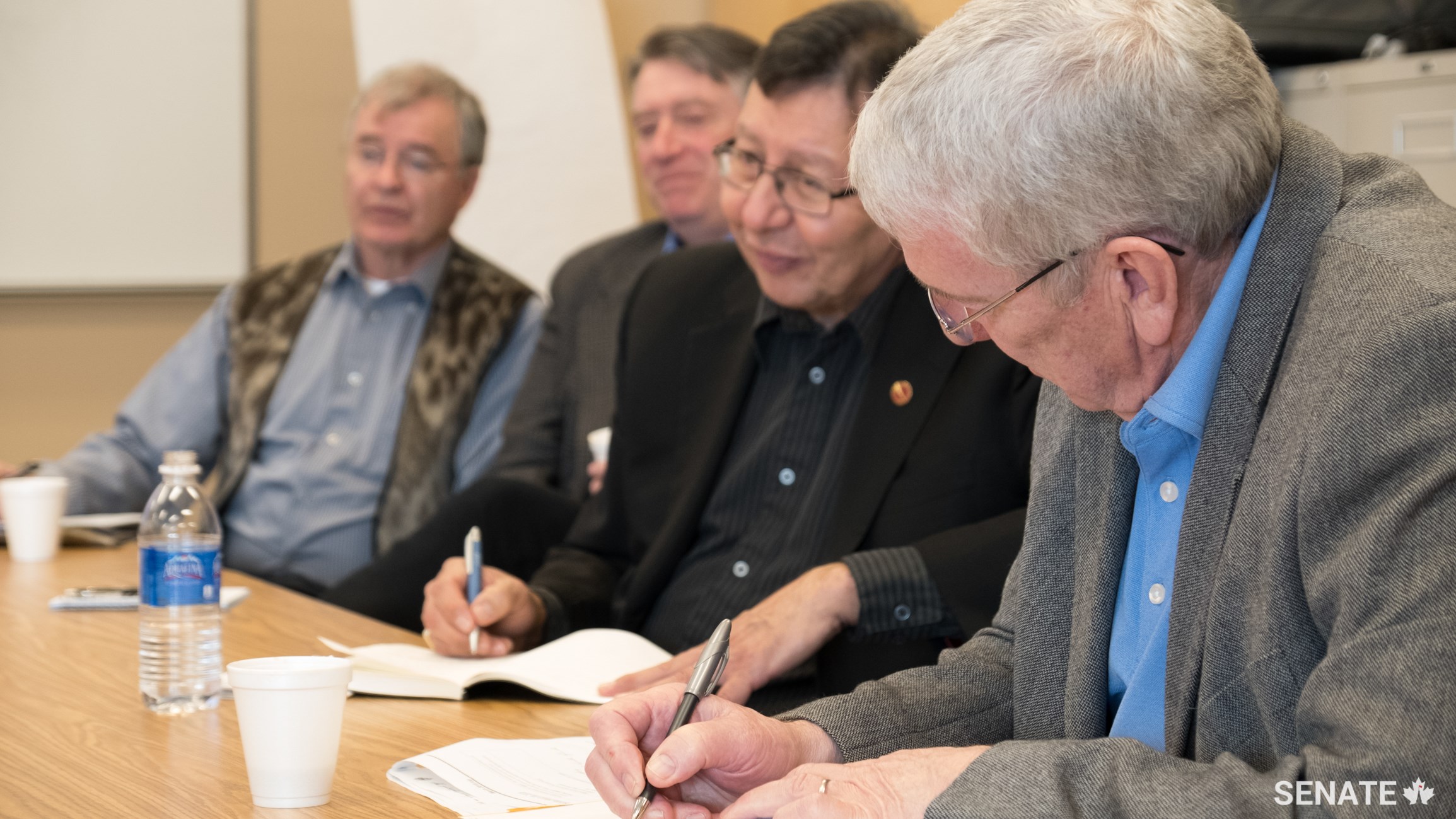 From left, senators Dennis Patterson, Scott Tannas, Dan Christmas and Norman Doyle listen as leaders in Île-à-la-Crosse, Sask. discuss the great potential of local, self-directed economic development.