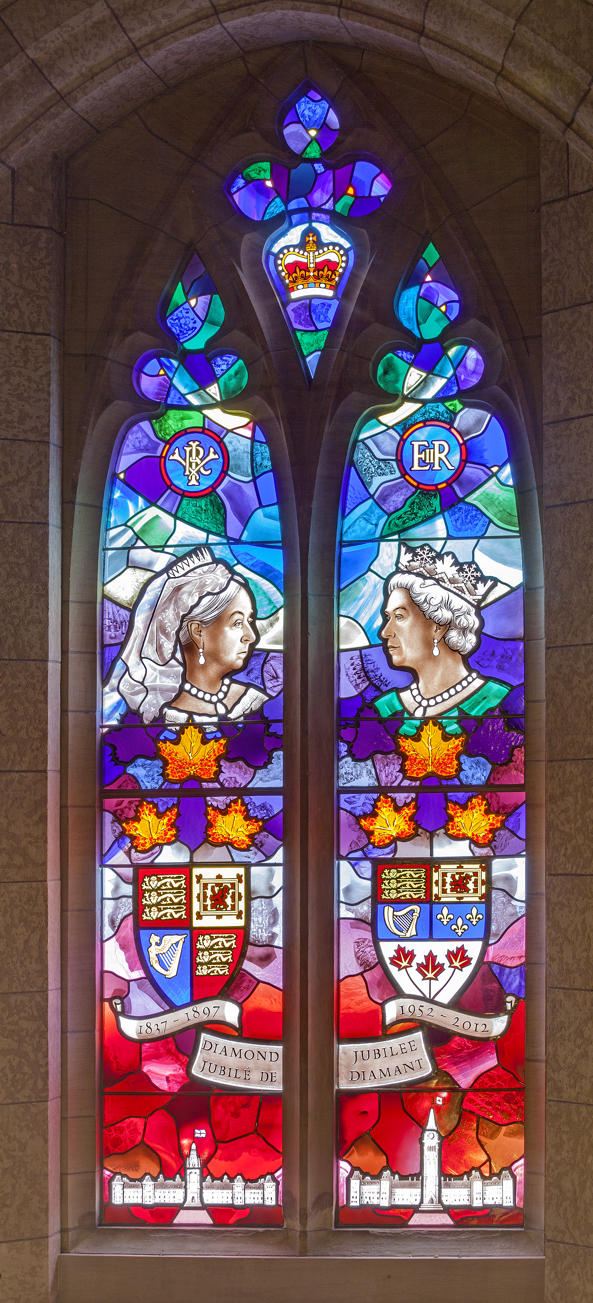 A stained-glass window above the Senate entrance to Centre Block depicts Queen Victoria on the occasion of her Diamond Jubilee in 1897, beside her great-great-granddaughter, Queen Elizabeth II, who marked her own Diamond Jubilee 115 years later in 2012. Below Victoria appears the original Centre Block and its iconic Victoria Tower, 19 years before they were gutted in the 1916 fire.