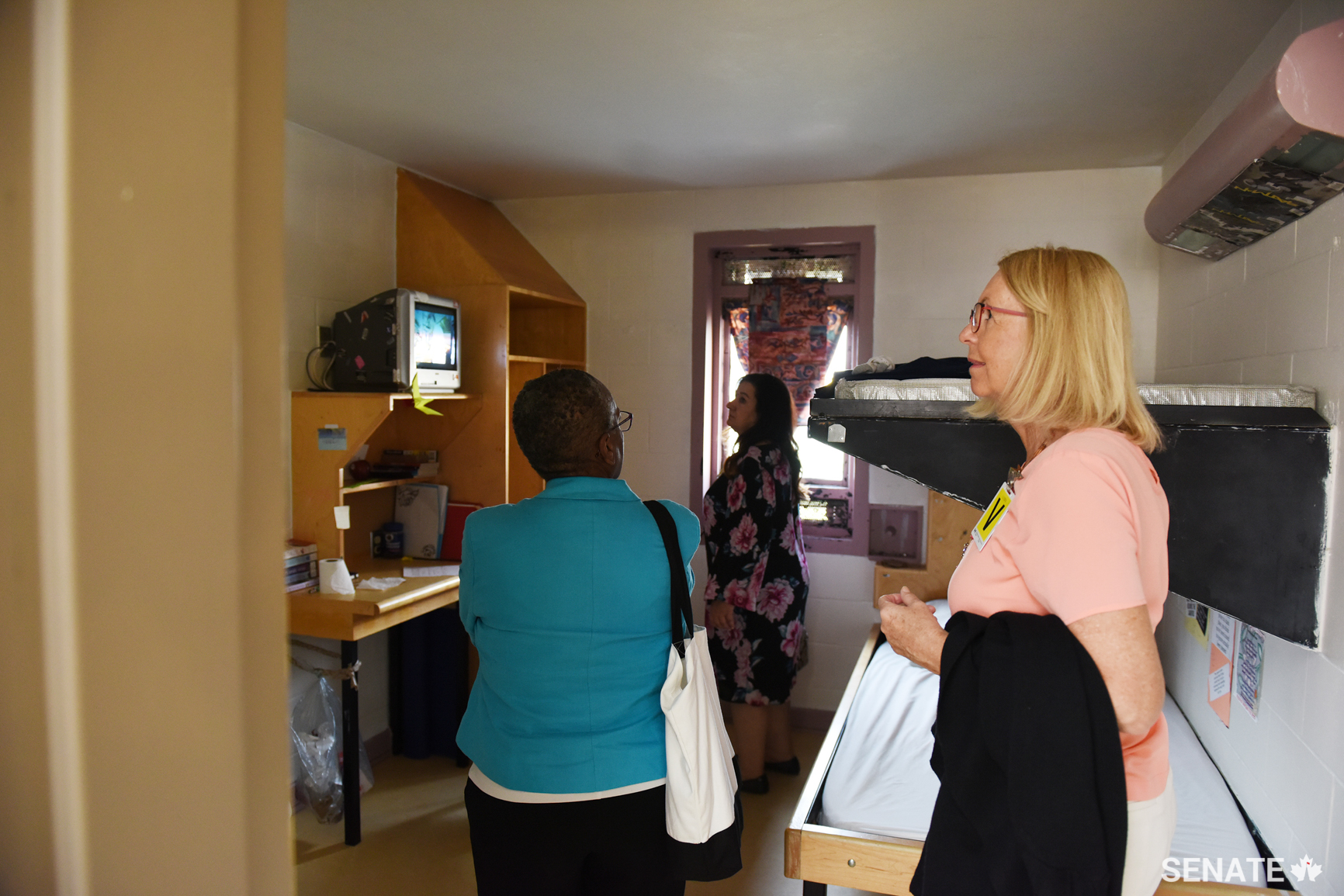 From left, senators Bernard, Ataullahjan and Cordy squeeze into a cell in a secure unit. Women prisoners who can afford fans place them beside tiny window slits to try to combat stifling heat; staff also complained about the heat. Health and safety concerns require staff offices to be air conditioned, but there is no air conditioning elsewhere in the prisons.