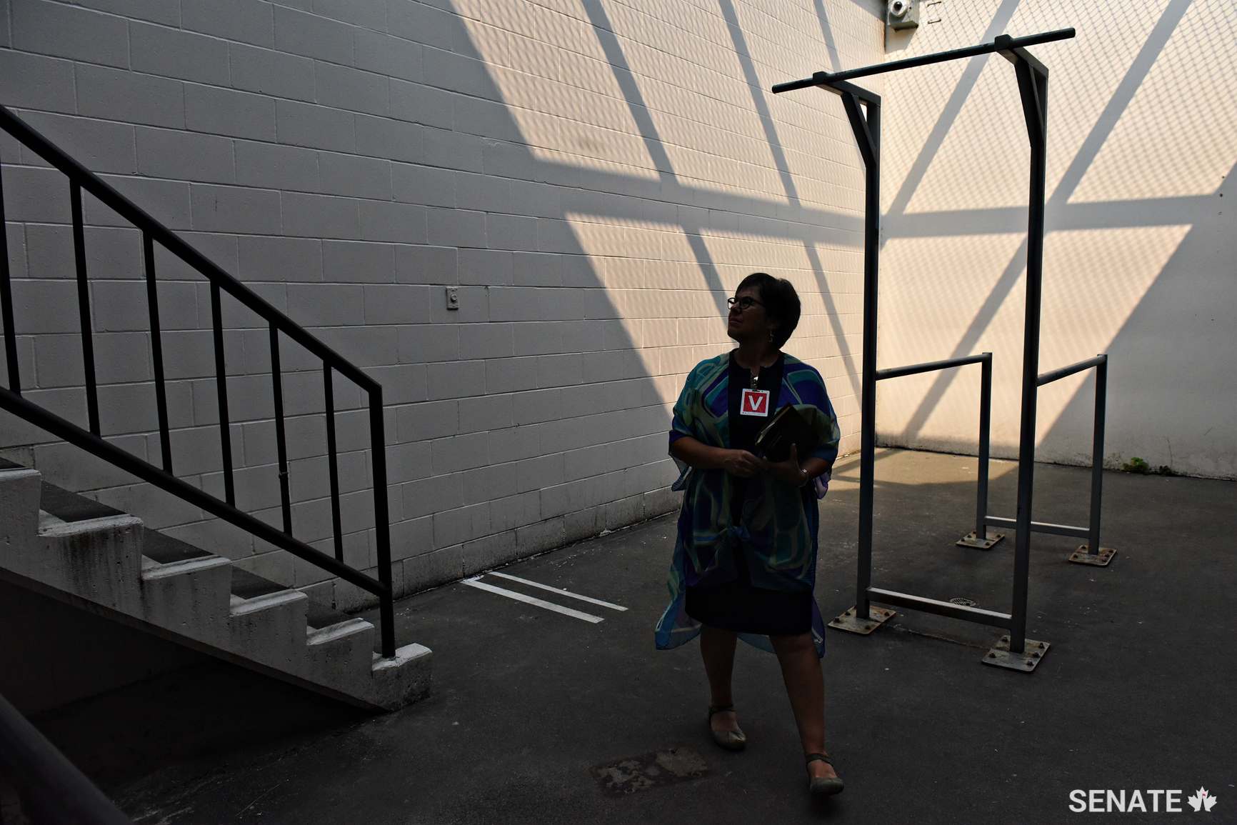 Senator Pate stands in an outdoor recreation yard in the Kent Institution’s segregation unit.