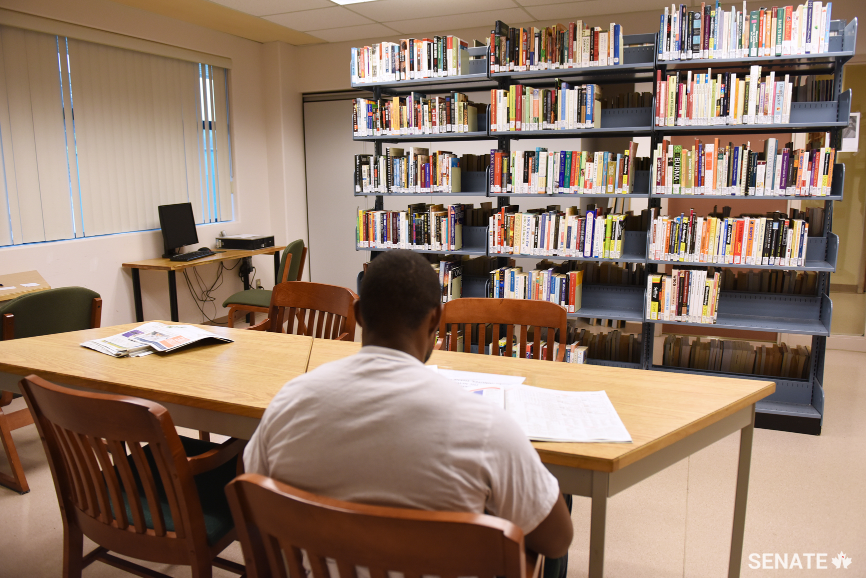 This man says he reads the newspaper in the library every morning in an effort to stay connected to the outside world.