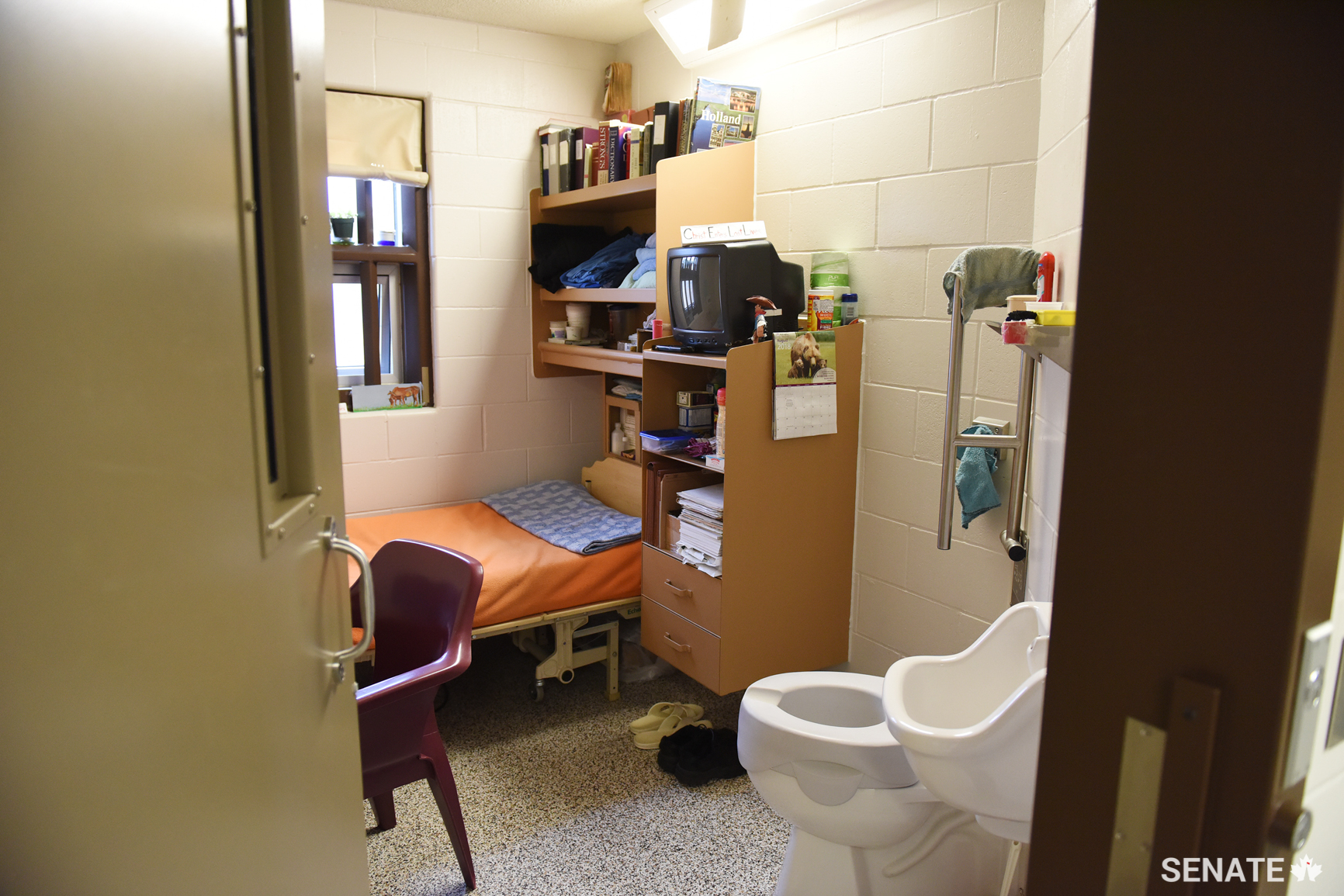 A view of a cell in the psychogeriatric unit, which houses older prisoners. The cells contain custom fittings such as raised toilet seats, grab bars and beds that can be moved up and down. Younger, able-bodied prisoners volunteer to assist the incapacitated prisoners.