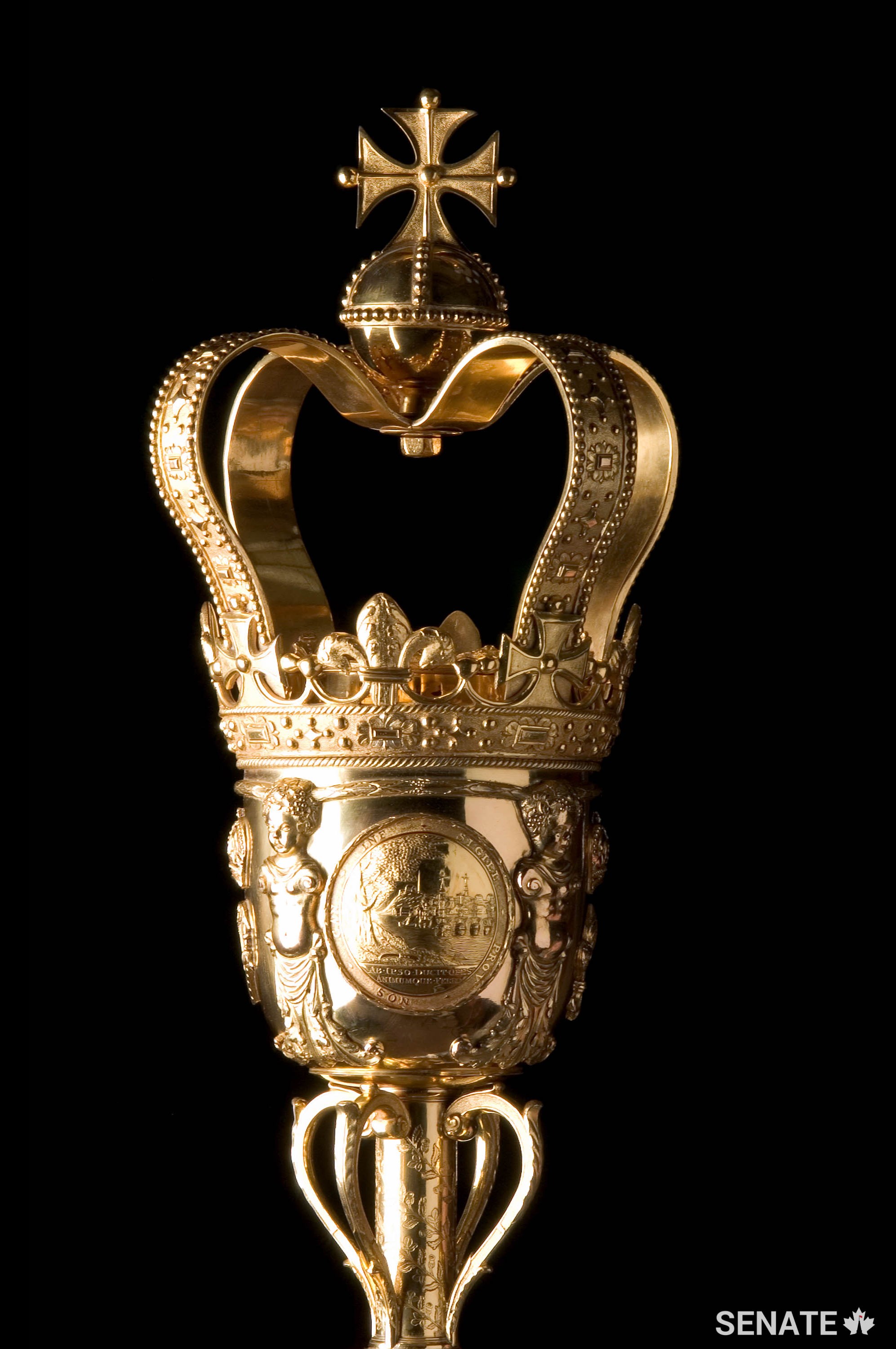 The 1.6-metre gold-plated brass Senate Mace weighs approximately 11 kilograms and symbolizes the monarch’s authority in the Senate of Canada.