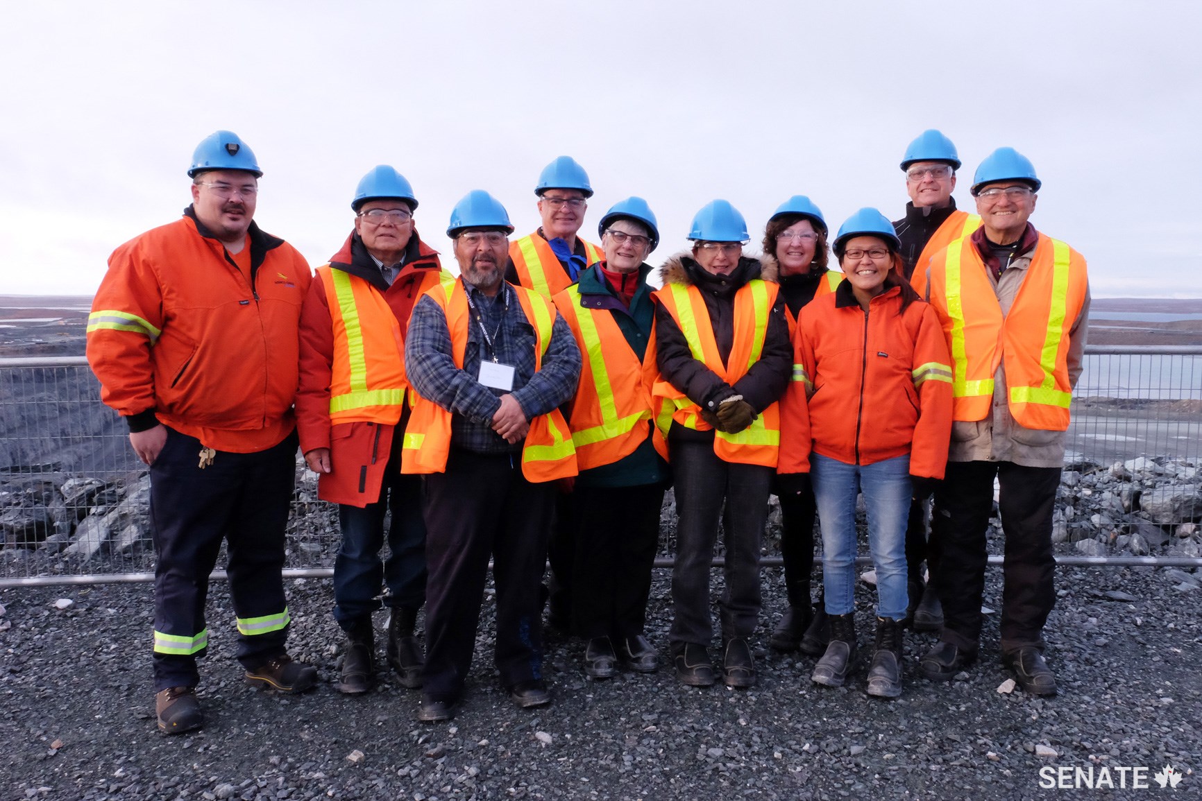 Senators on the Arctic committee pose with employees at Meadowbank Mine in the Kivalliq region of Nunavut, located 110 kilometres north of Baker Lake. Agnico Eagle Mines operates the gold mine and employs more than 2,000 workers, many of whom identify as Inuit. An impact benefit agreement with the Kivalliq Inuit Association created economic development funds for training and hiring of Inuit workers. In 2017, 38% of all training at the mine was dedicated to Inuit employees and 66% of the female workforce was Inuit.