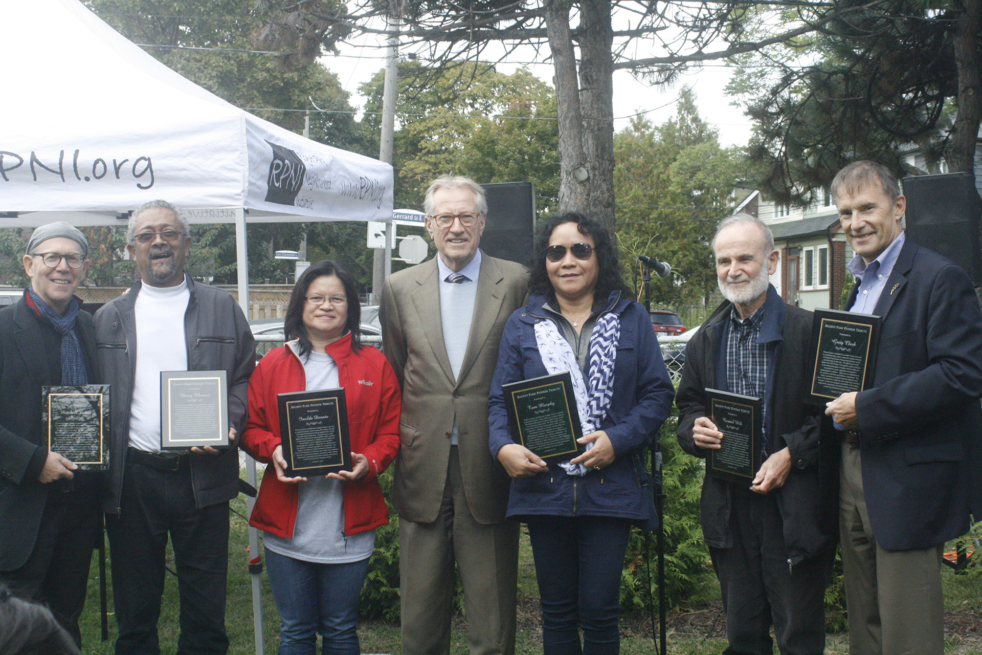 Senator Art Eggleton, centre, with citizen activists who pioneered the Regent Park Revitalization project in Toronto in 2011.