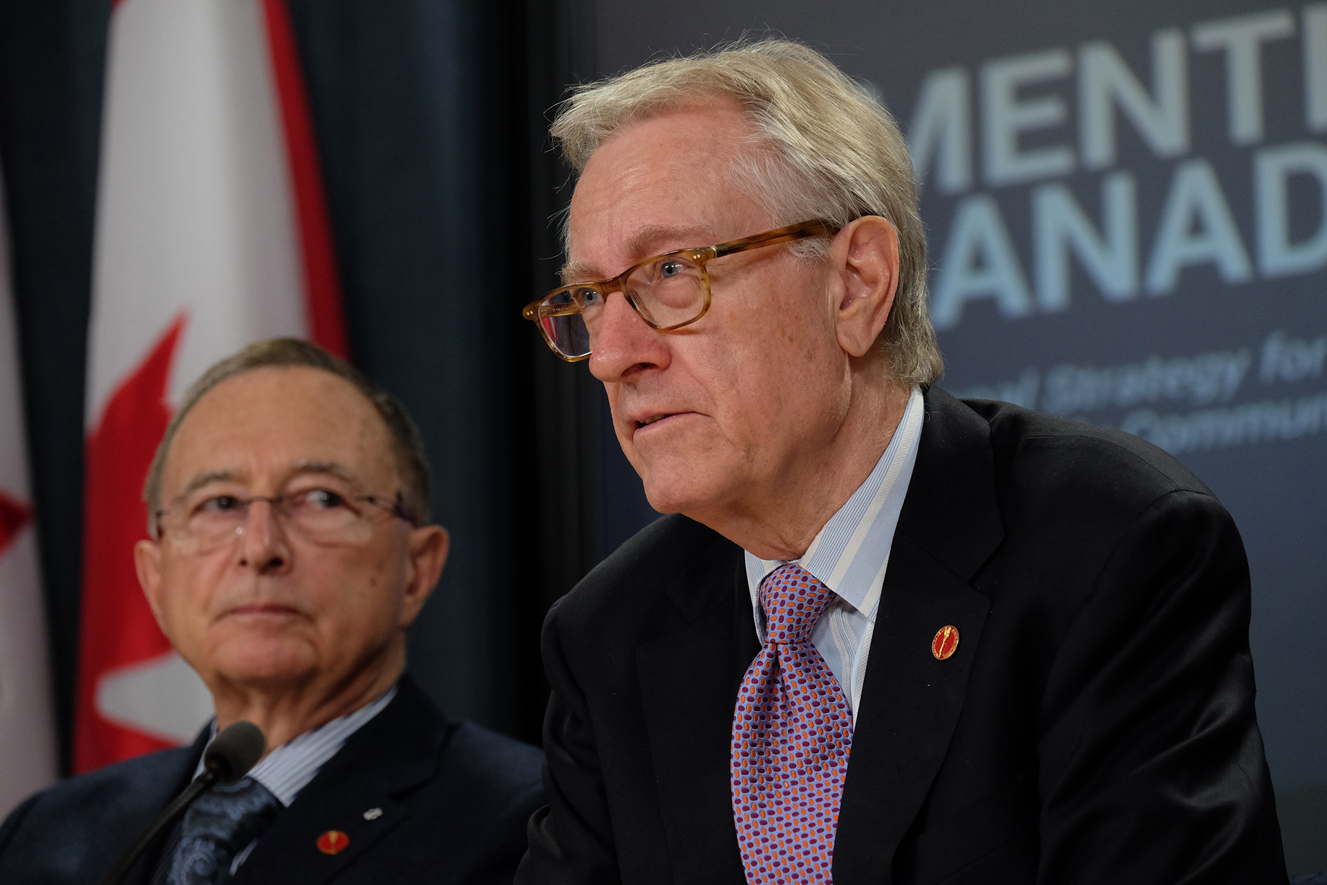 Senator Art Eggleton, right, speaks at a press conference on November 15, 2016, after the release of the social affairs committee’s report on dementia.