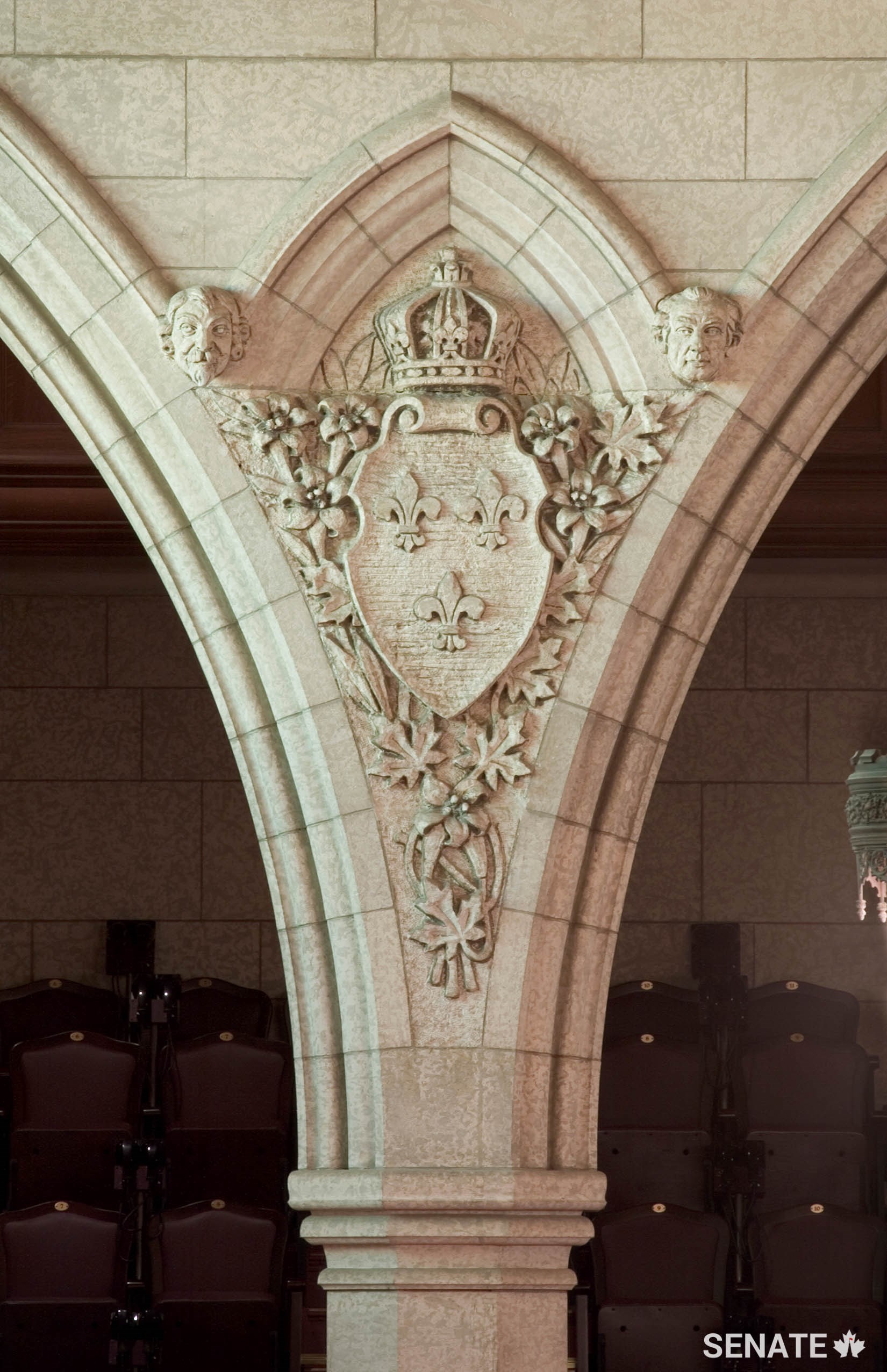 The arms of France Moderne, adopted by King Charles V in 1376, decorate a spandrel between supporting columns at the south end of the Senate Chamber.