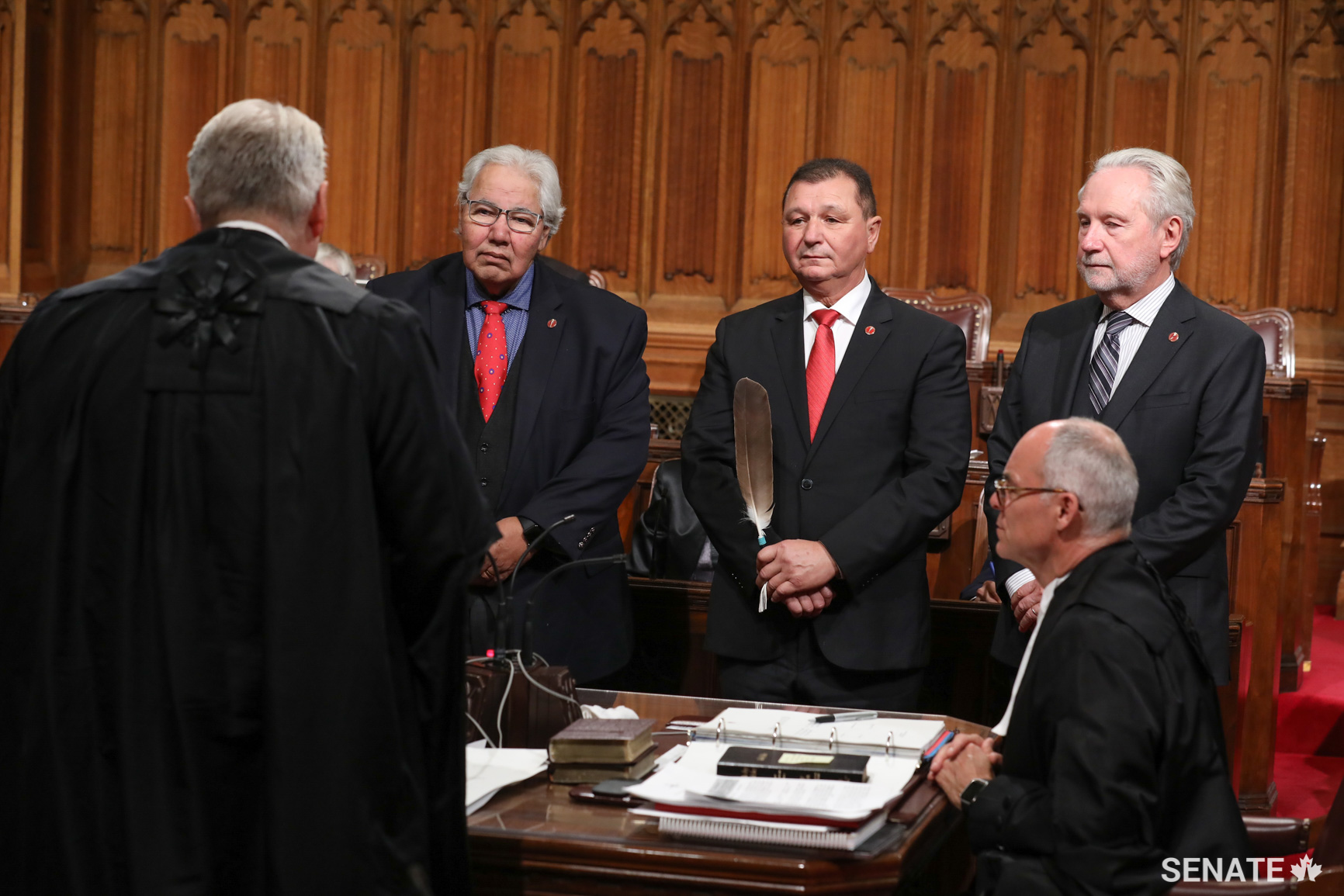 Senator Brian Francis, centre, is joined by Senators Murray Sinclair and Peter Harder during Senator Francis’ swearing-in ceremony on October 16, 2018.