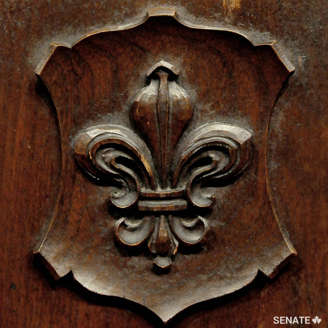 A French fleur-de-lis decorates a senator’s desk in the Red Chamber.