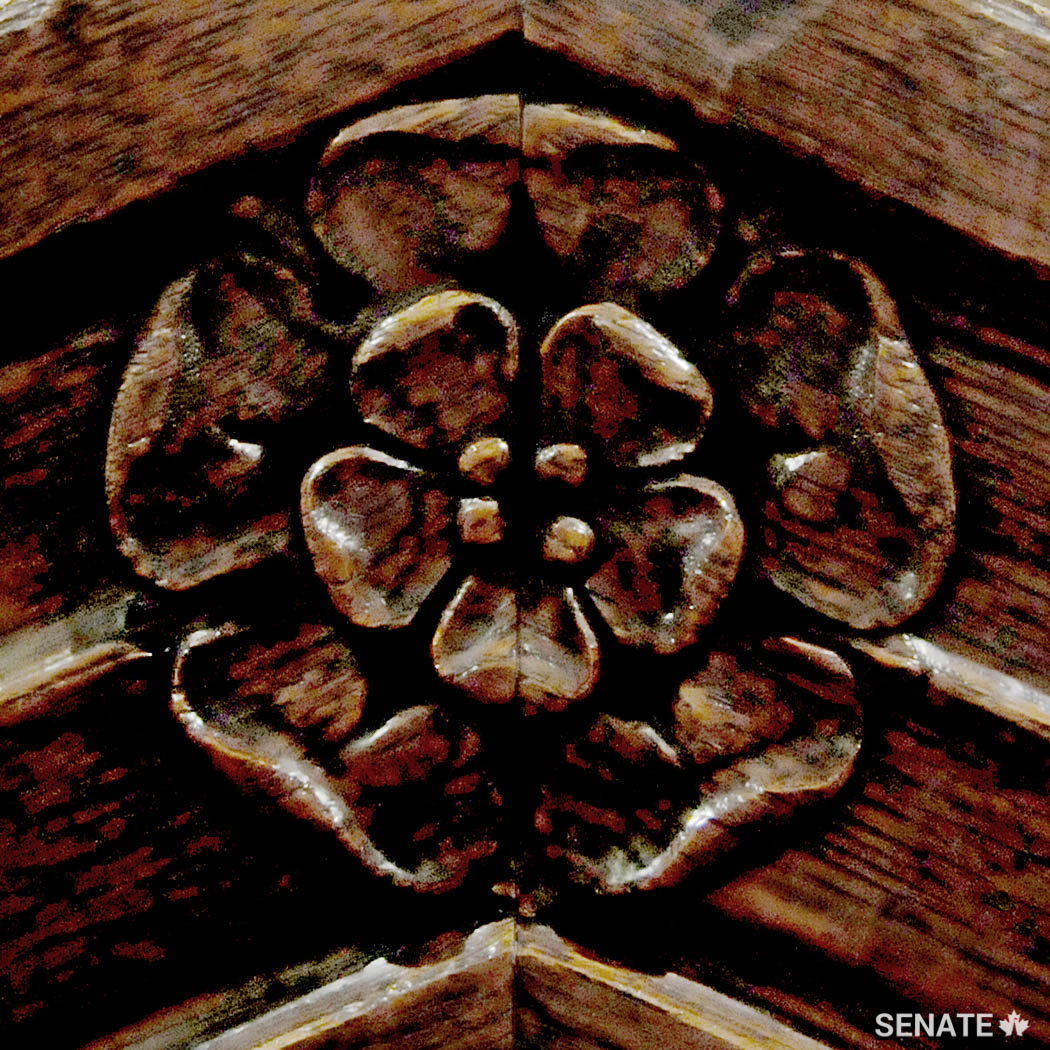 A Tudor rose, a traditional emblem of England, is carved in the back of the Senate Speaker’s chair.