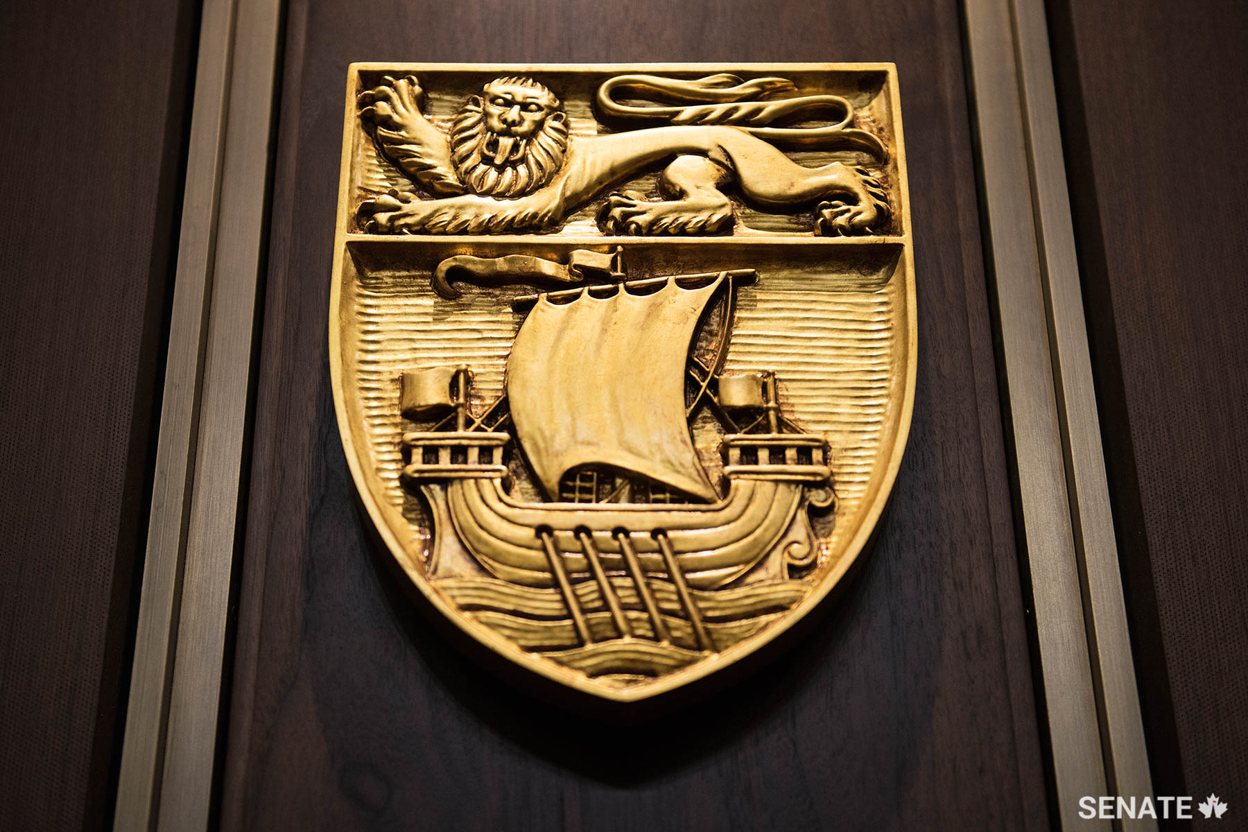 The shield of New Brunswick features an English lion above a galleon that evokes the province’s historic connection to the sea.