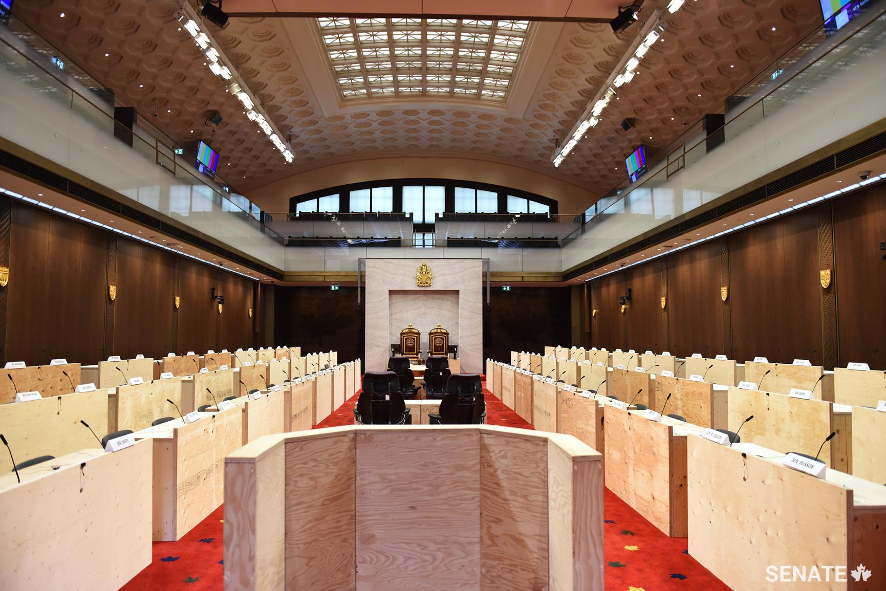 Crews will work through the winter adjournment to move senators’ desks and chairs as well as the clerks’ table from the Senate Chamber in Centre Block to the temporary Chamber in the Senate of Canada Building. The new space is less ornate than the Centre Block Chamber but its furnishings, configuration and restrained elegance will clearly reflect the old Senate Chamber.
