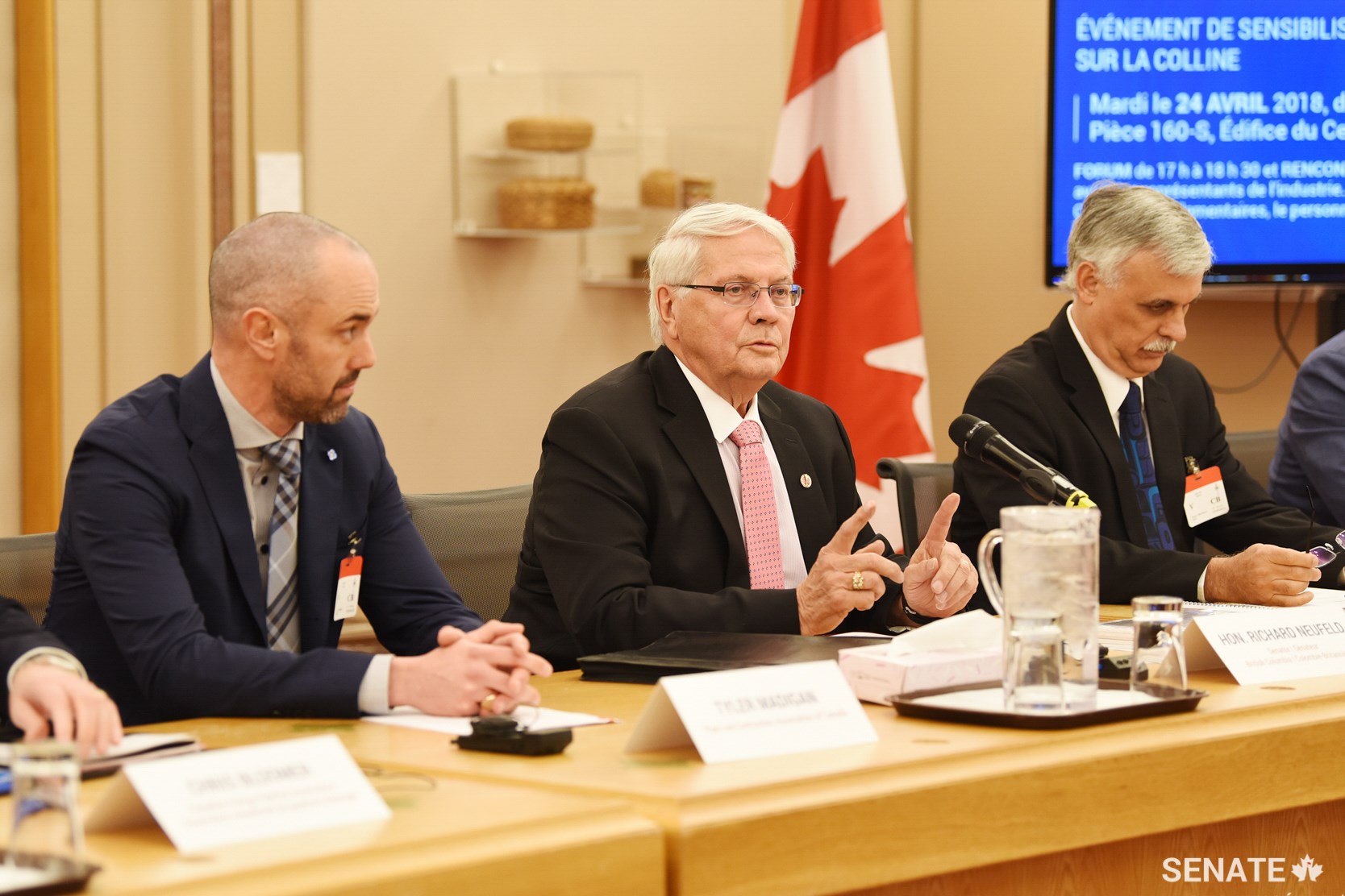 Senator Richard Neufeld, centre, chairs a panel discussion for the Tanker and Pipeline Safety Awareness Session on April 24, 2018, in Ottawa.
