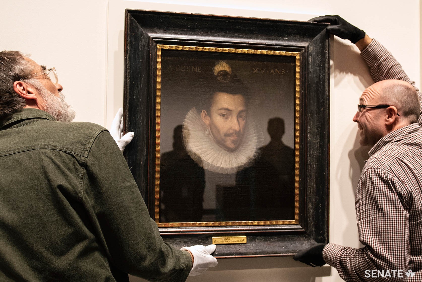 Freshly uncrated, Henri III appears to watch with trepidation as exhibition preparators settle his portrait onto a custom-built mounting in the foyer of the Senate of Canada Building in October 2019.